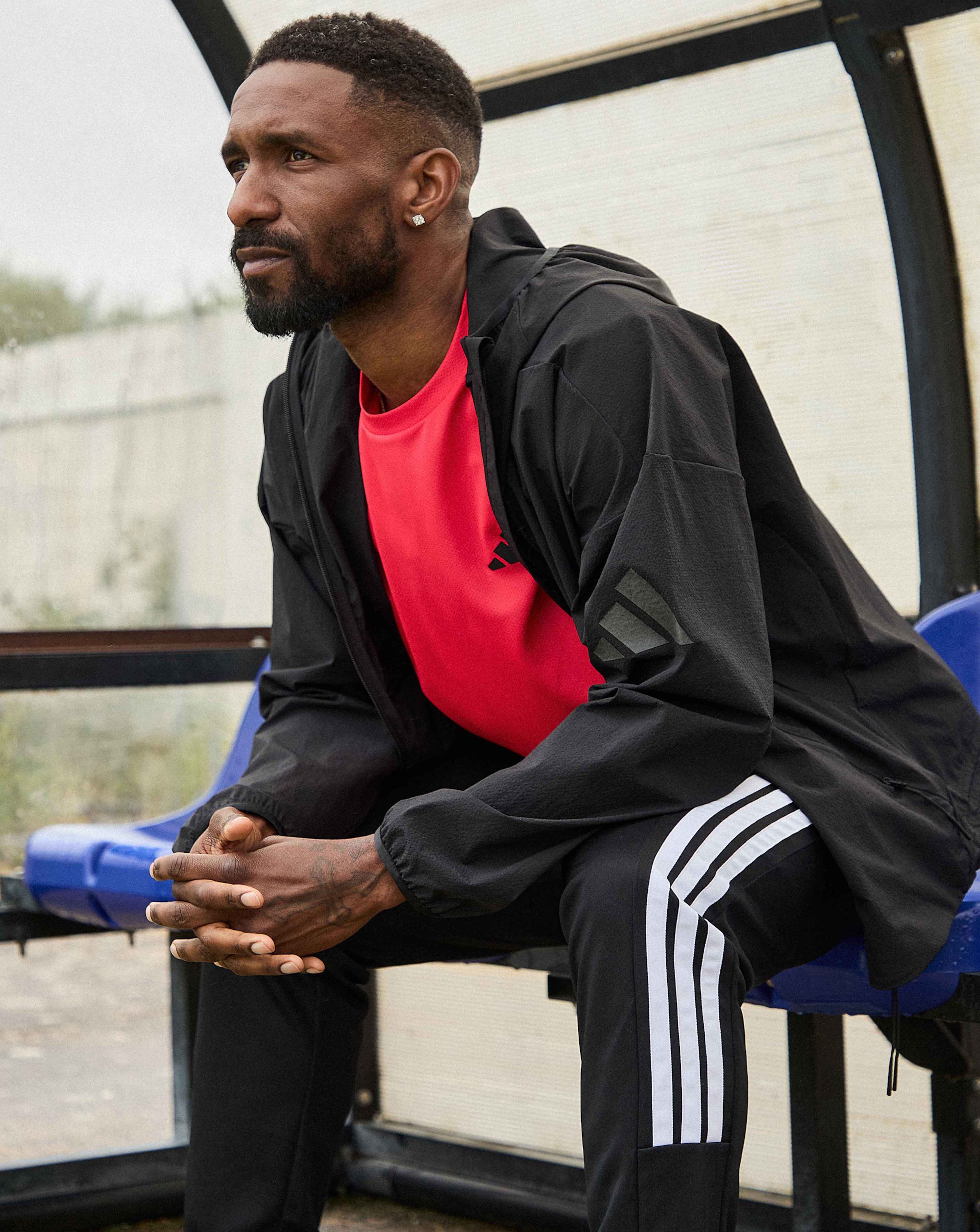 Jermaine Defoe wears adidas Workout Essentials Training T-Shirt with adidas Myshelter Wind Cheater Jacket