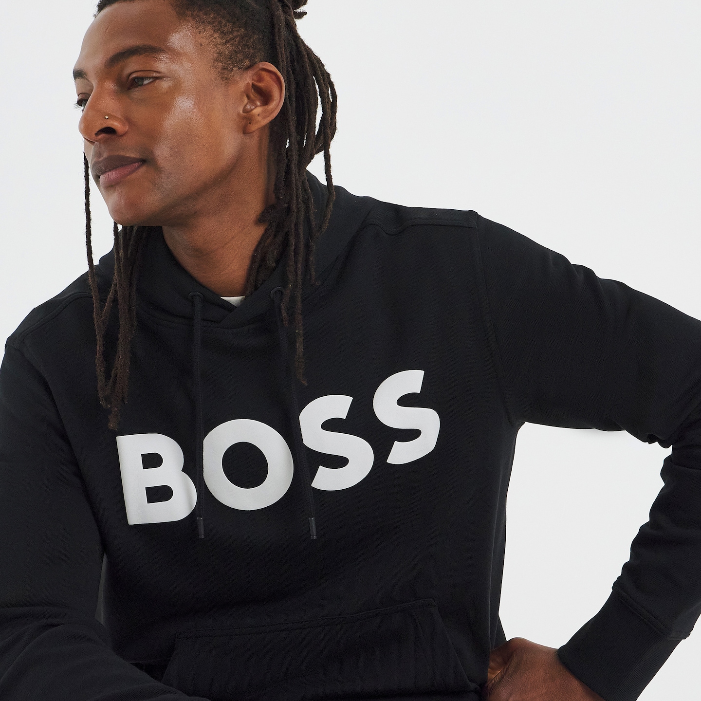 Model is wearing a black BOSS Classic logo hoodie.