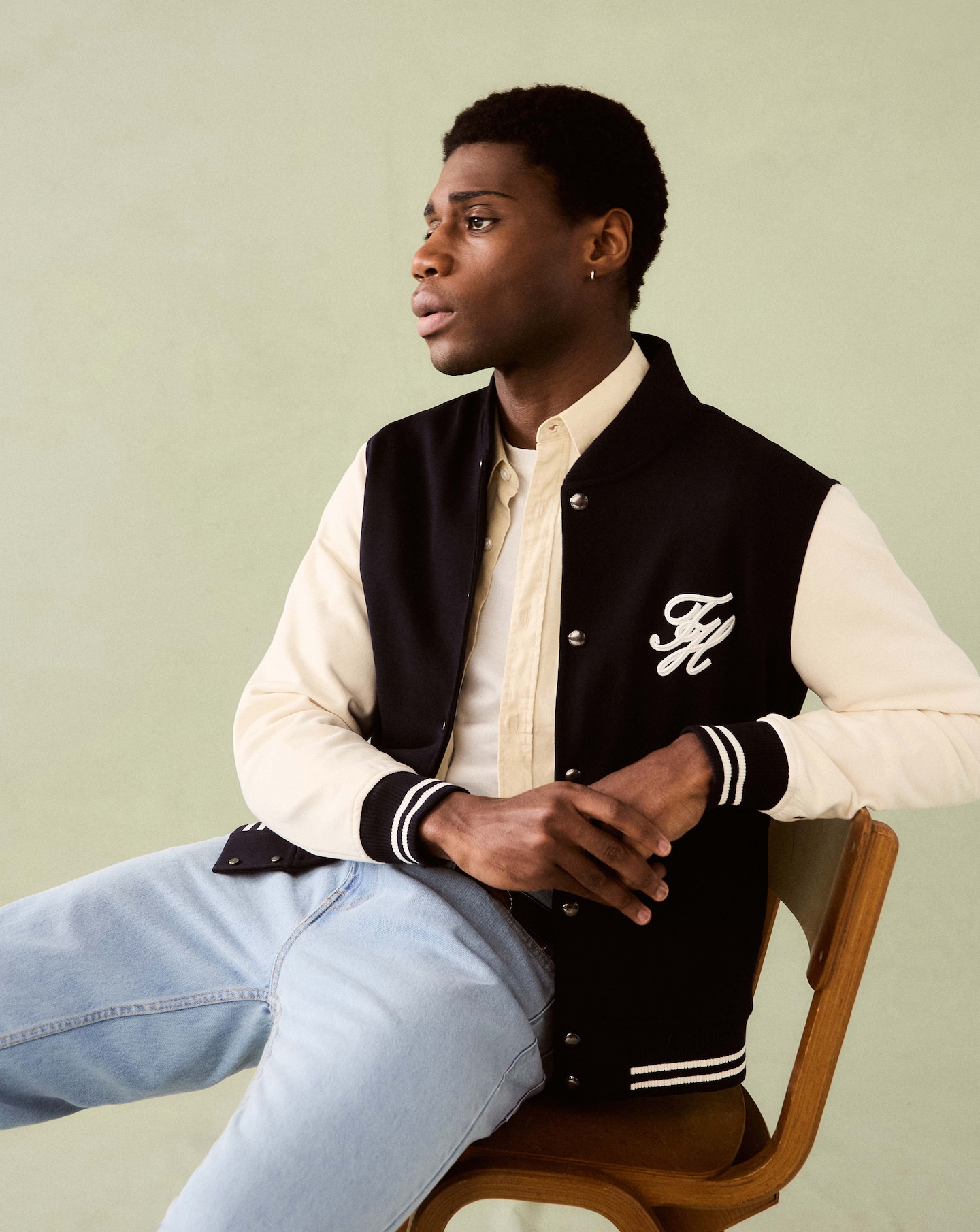 Model is wearing a Tommy Hilfiger Script Colourblock Bomber Jacket