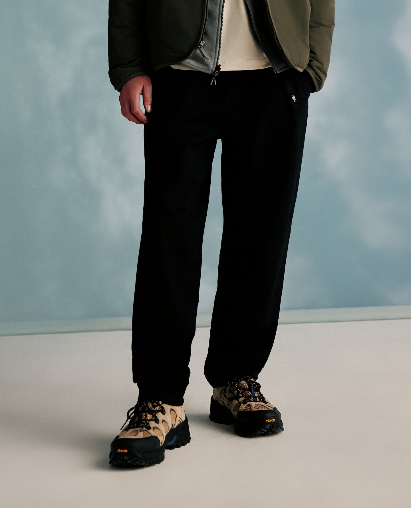 Model wears black hiking trousers from The North Face