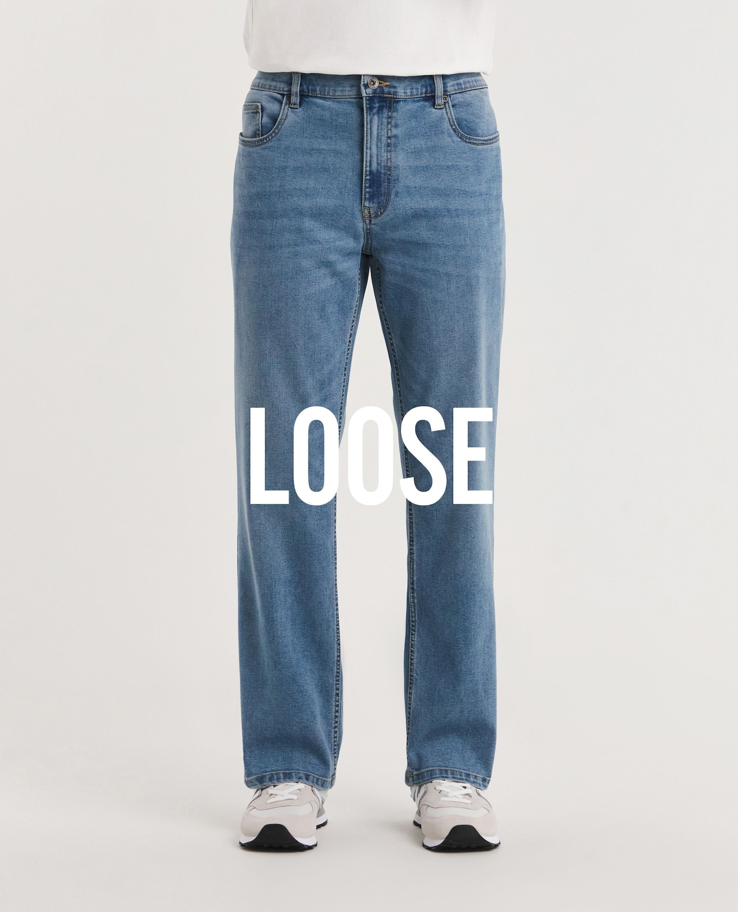 Close up image of a blue pair of loose fit jeans
