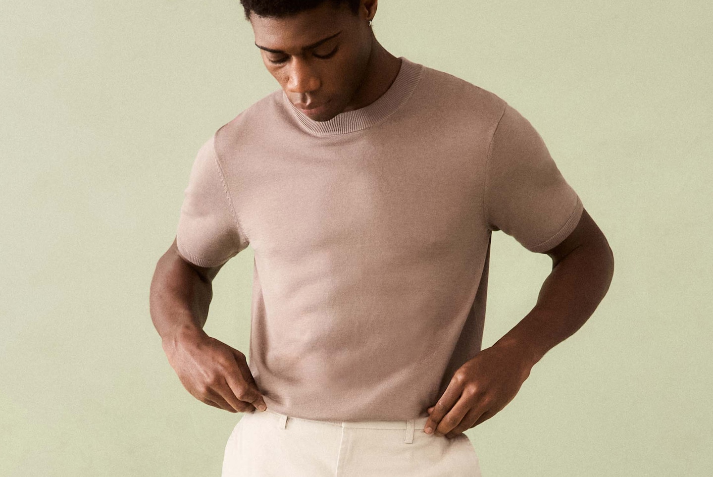 Model wears Knitted Crew Neck T-Shirt with Cream Trouser