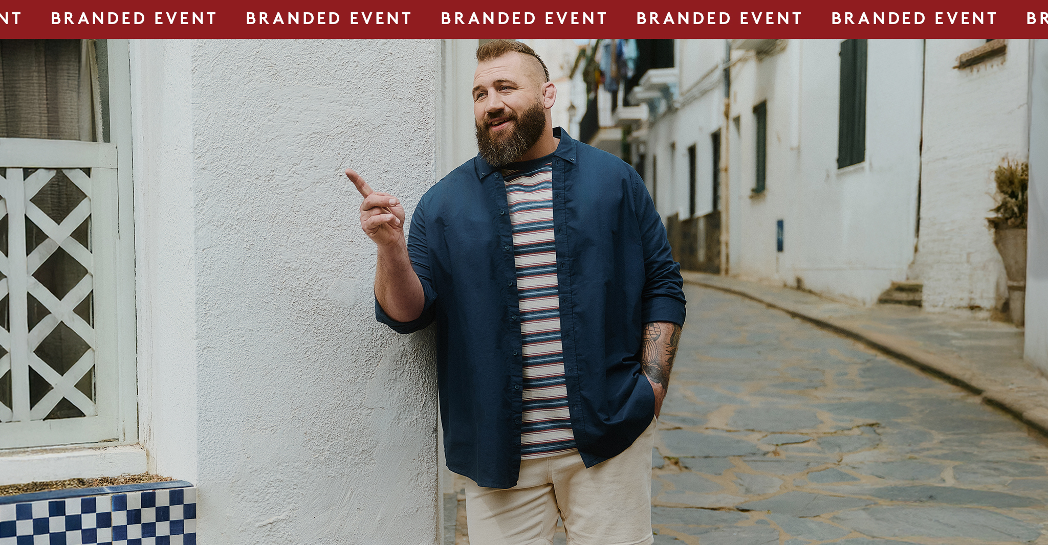 The Big Brand Bank Holiday Event up to 50% OFF* Joe Marler wears Union Relaxed Fit Marl Yarn Dye Stripe T-Shirt Long with Navy shirt and cream shorts