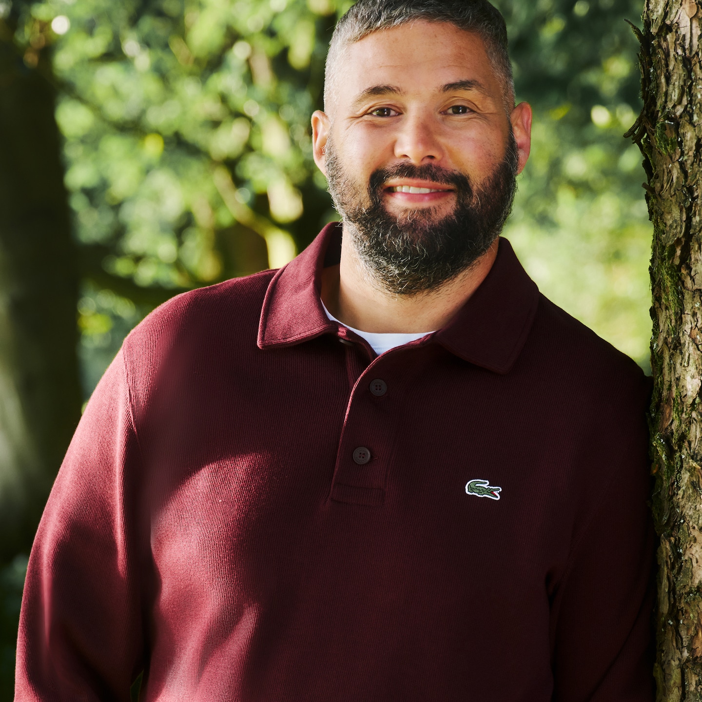 Tony wears long sleeve polo from Lacoste