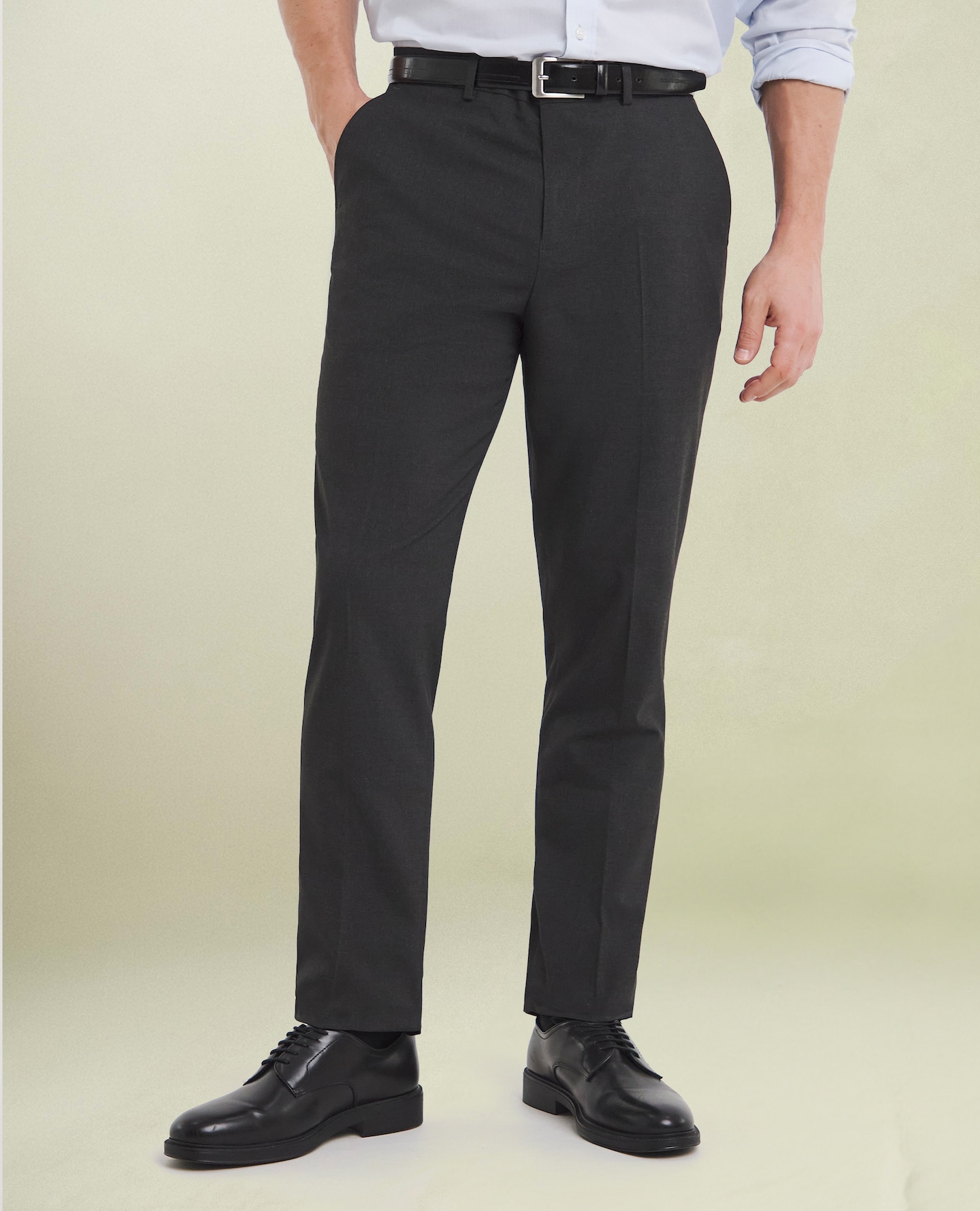 Model wears Regular Fit Plain Front Stretch Trouser in Charcoal