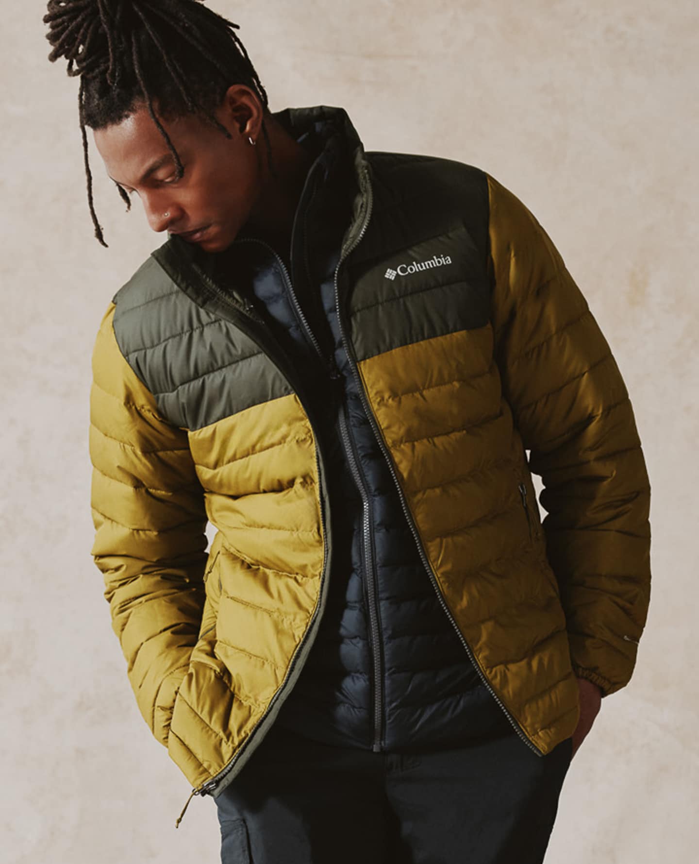 Model wears Columbia Powder Lite II Jacket with Navy Lightweight Padded Gilet