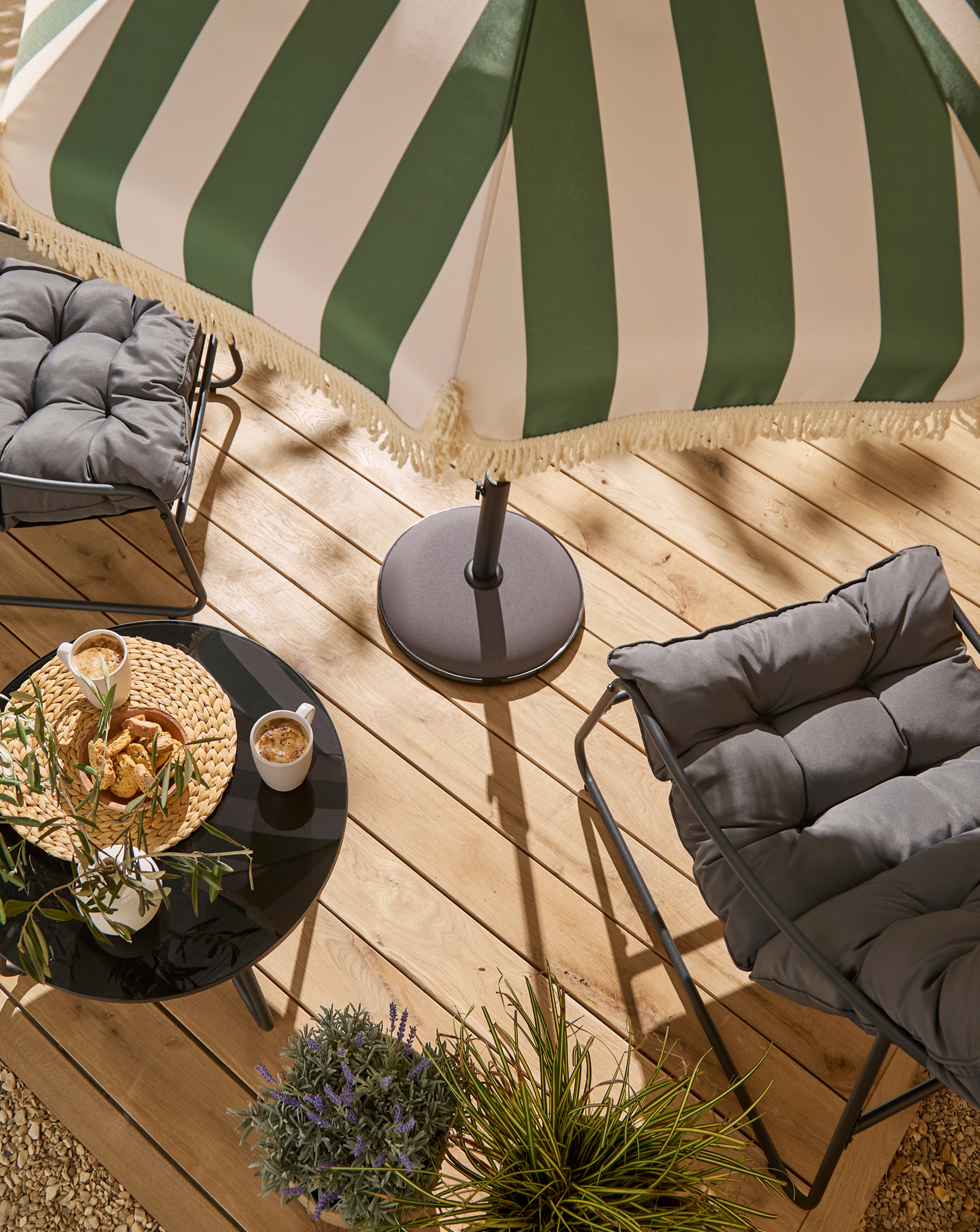 Grey padded garden chairs with Stripe Parasol pictured.