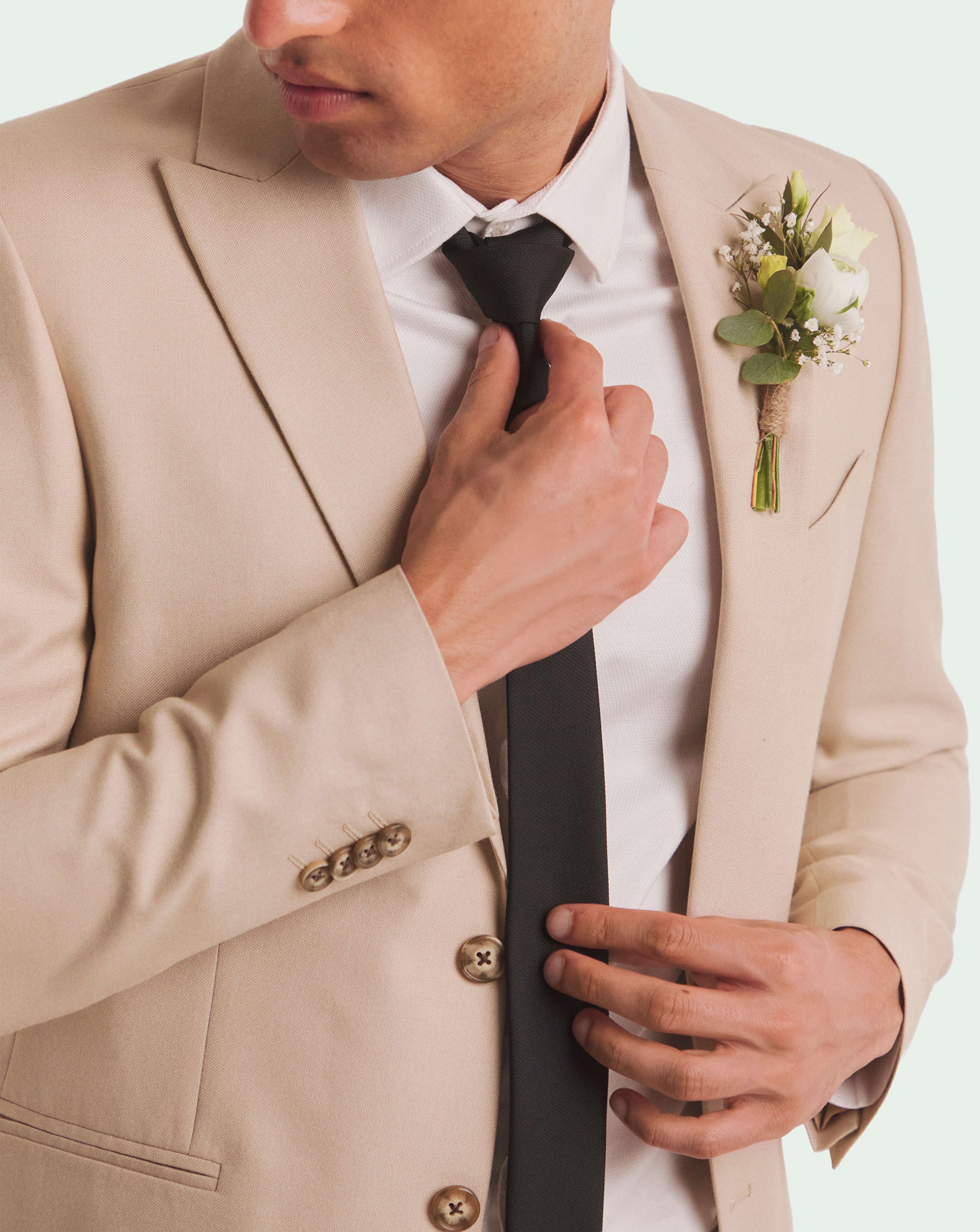 Model wears Tailored Suit Jacket in Stone