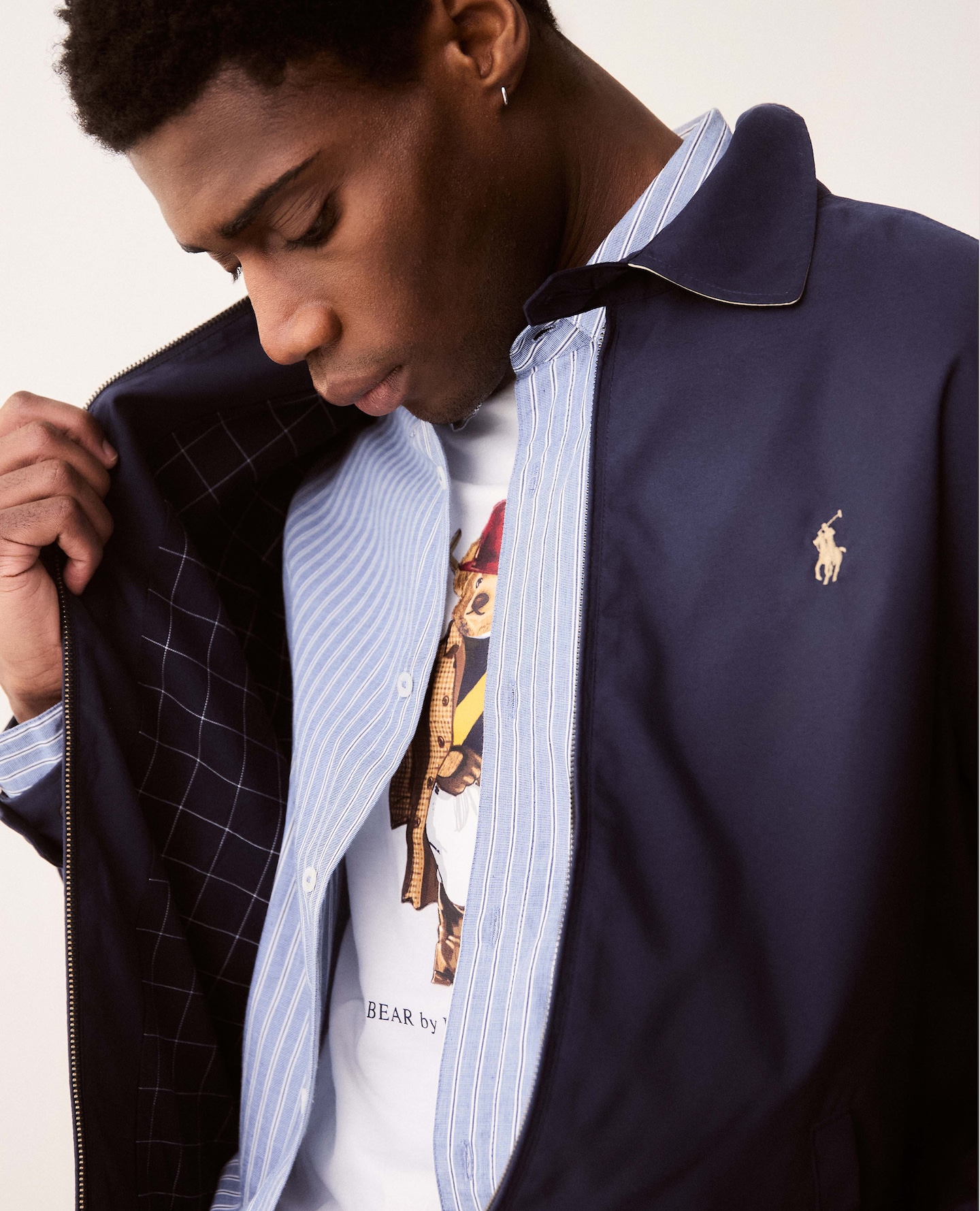 Modle wears Polo Ralph Lauren Bi Swing Jacket with Polo Ralph Lauren Short Sleeve Bear T-Shirt - White