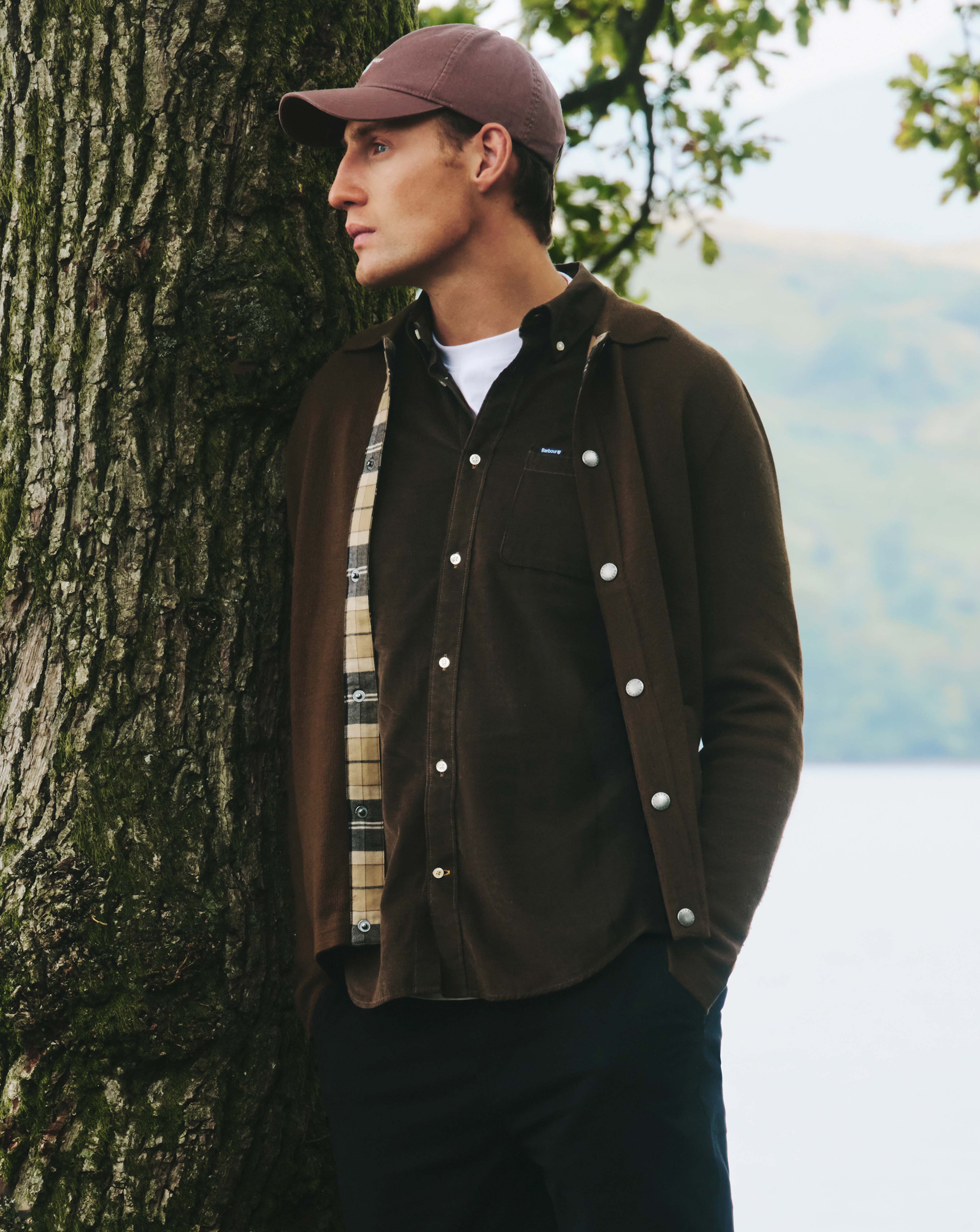 Model wears Barbour Florcombe Knitted Cardigan - Dark Sand