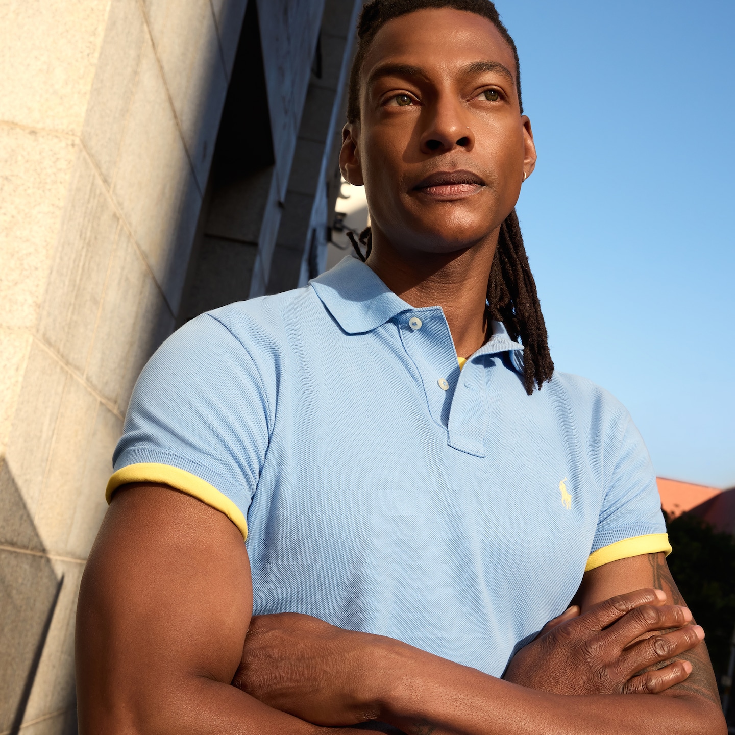 Model is wearing a blue Polo Ralph Lauren Classic short sleeve polo.
