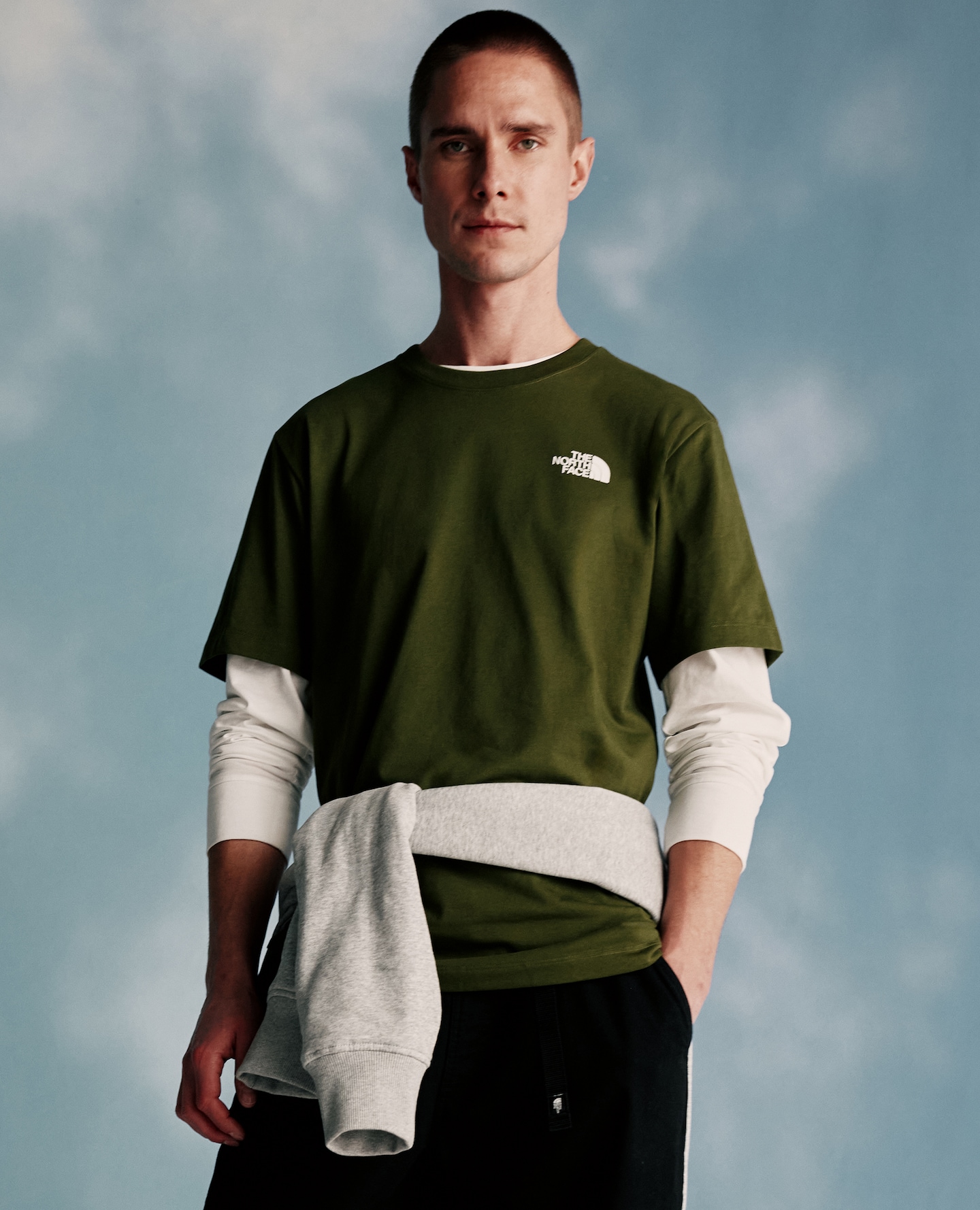 Model wears Olive t-shirt and base layer from The North Face