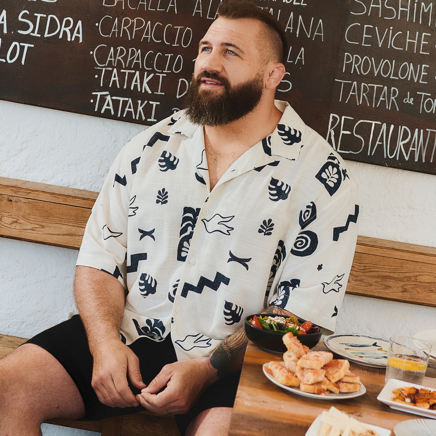 Joe Marler wears Jack & Jones pattern shirt with black shorts