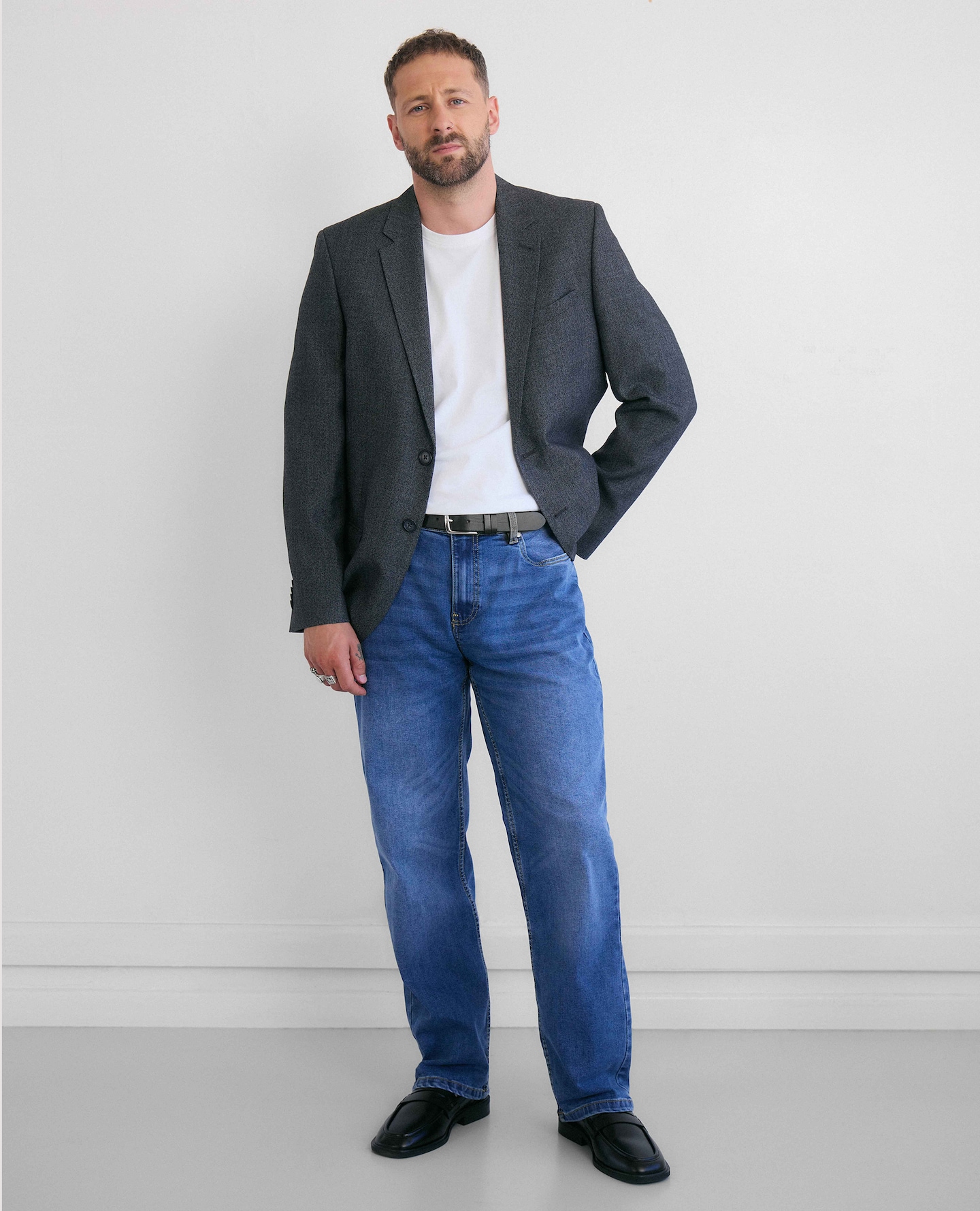 Model wears Regular Fit Classic Suit Jacket and Suit Trousers