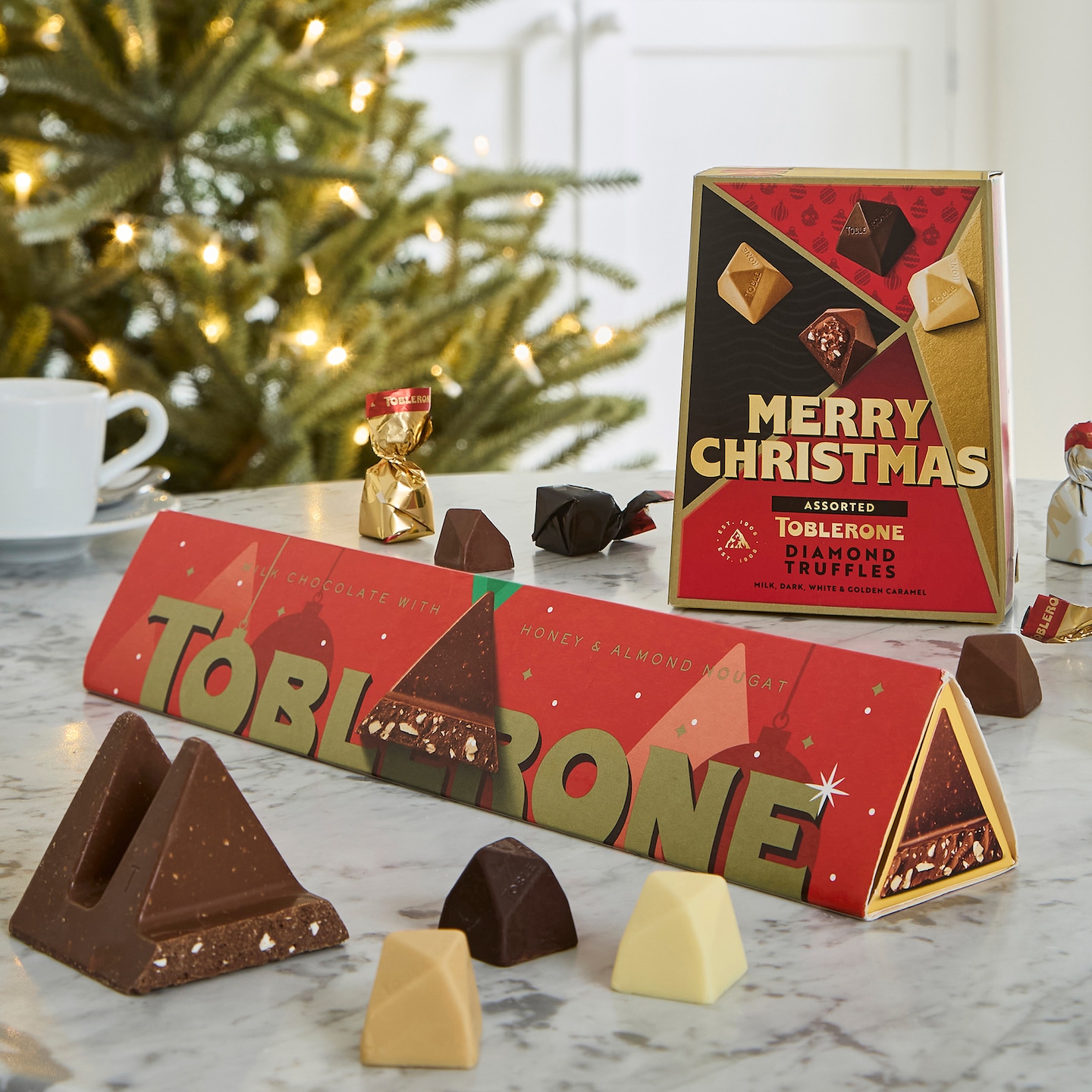 Toblerone Christmas Truffle Bundle is pictured against Christmas backdrop.
