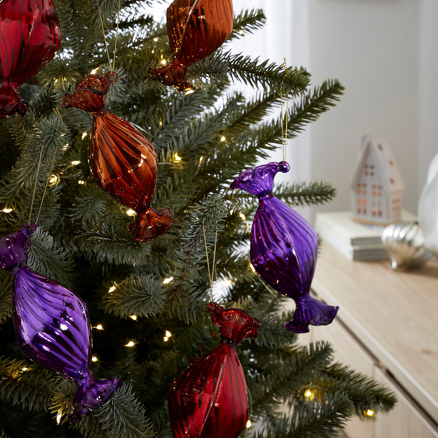 Set of 6 Glass Sweet Baubles are pictured on a Christmas tree