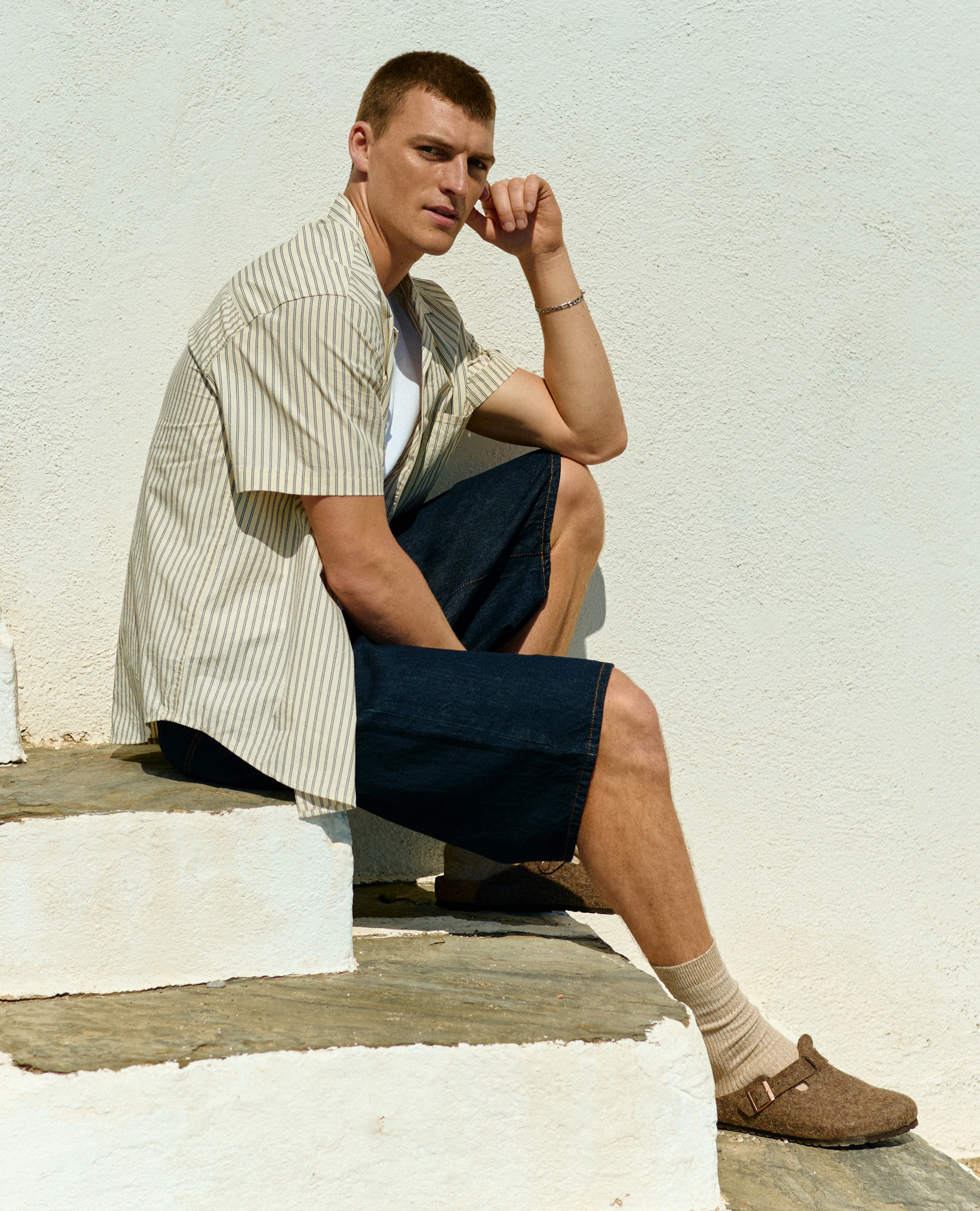 Model wears Calvin Klein Jeans Short Sleeve Cotton Poplin Shirt - Beige with Only & Sons Carl Loose Denim Shorts - Blue