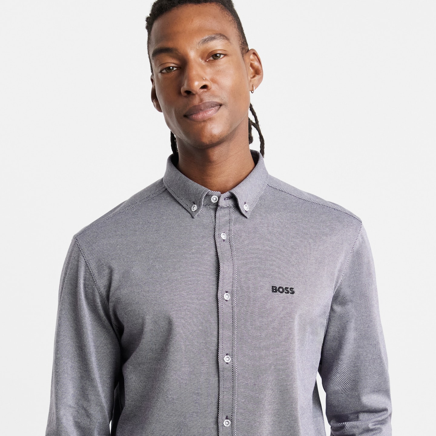 Model is wearing a purple BOSS long sleeve motion printed shirt.