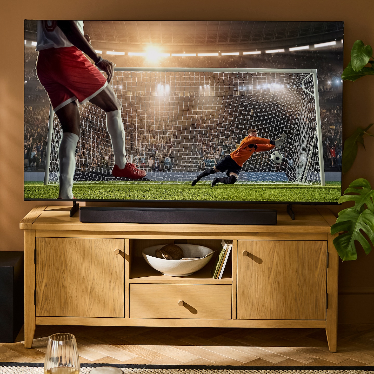 TV with football game is pictured.