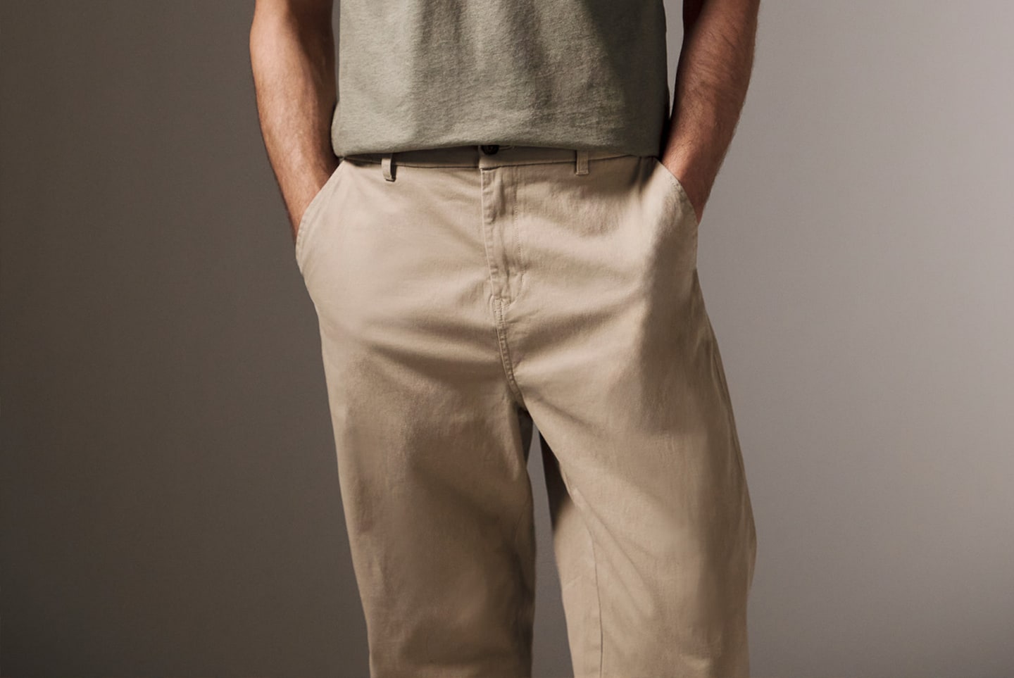 Model weats Tapered Fit Chino in Cream