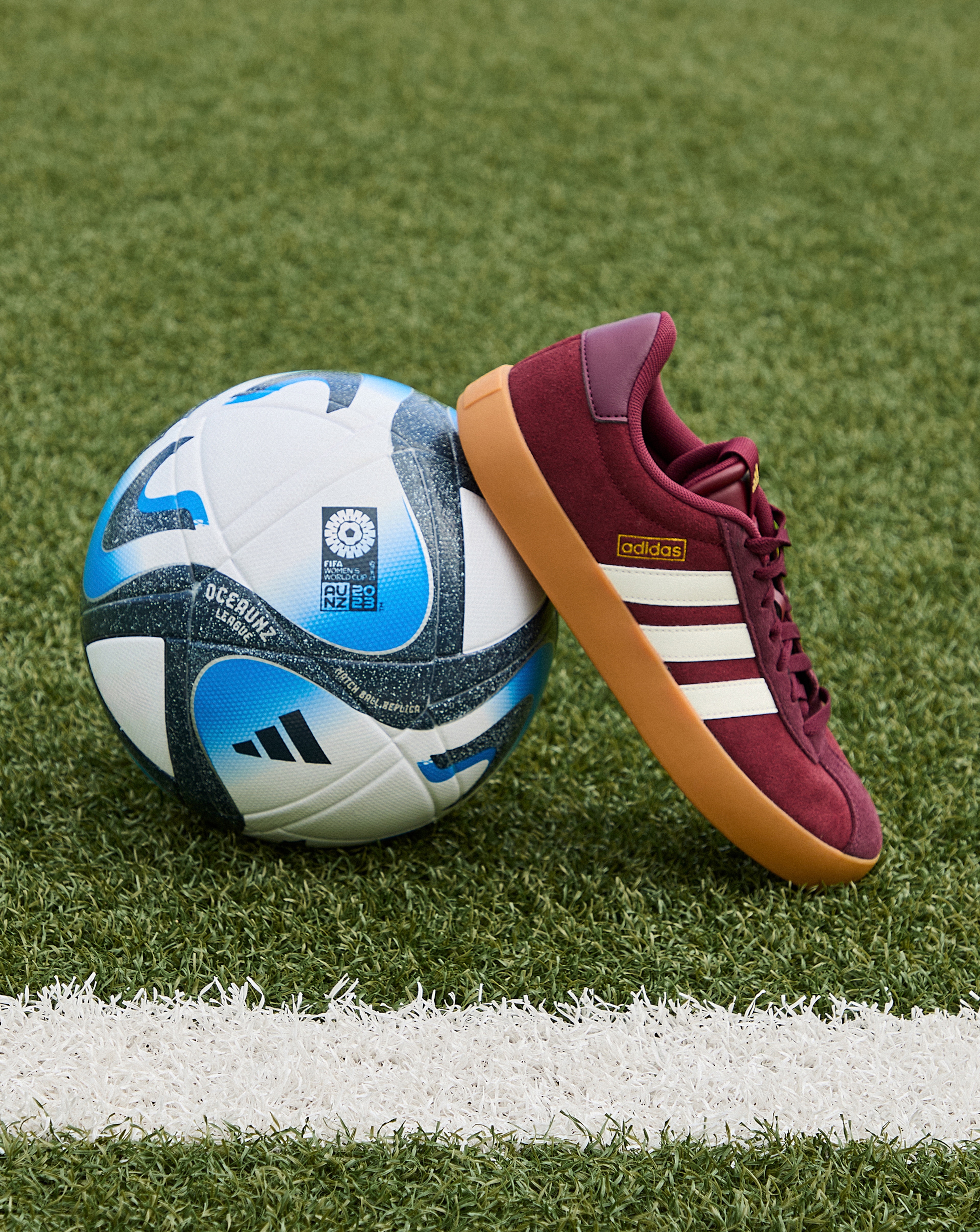 adidas VL Court 3.0 Trainers is pictured next to adidas football