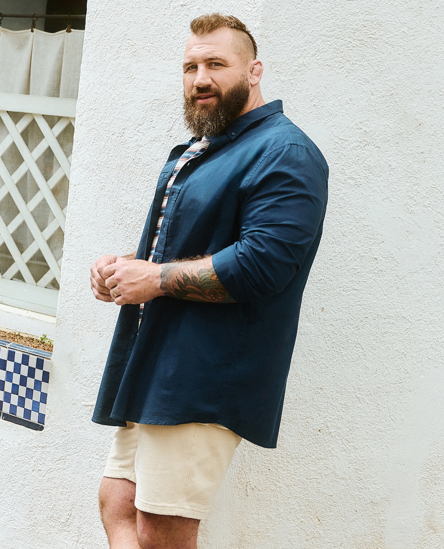 Joe Marler wears Navy Blue Long Sleeve Shirt with Union Relaxed Fit Marl Yarn Dye Stripe T-Shirt Long