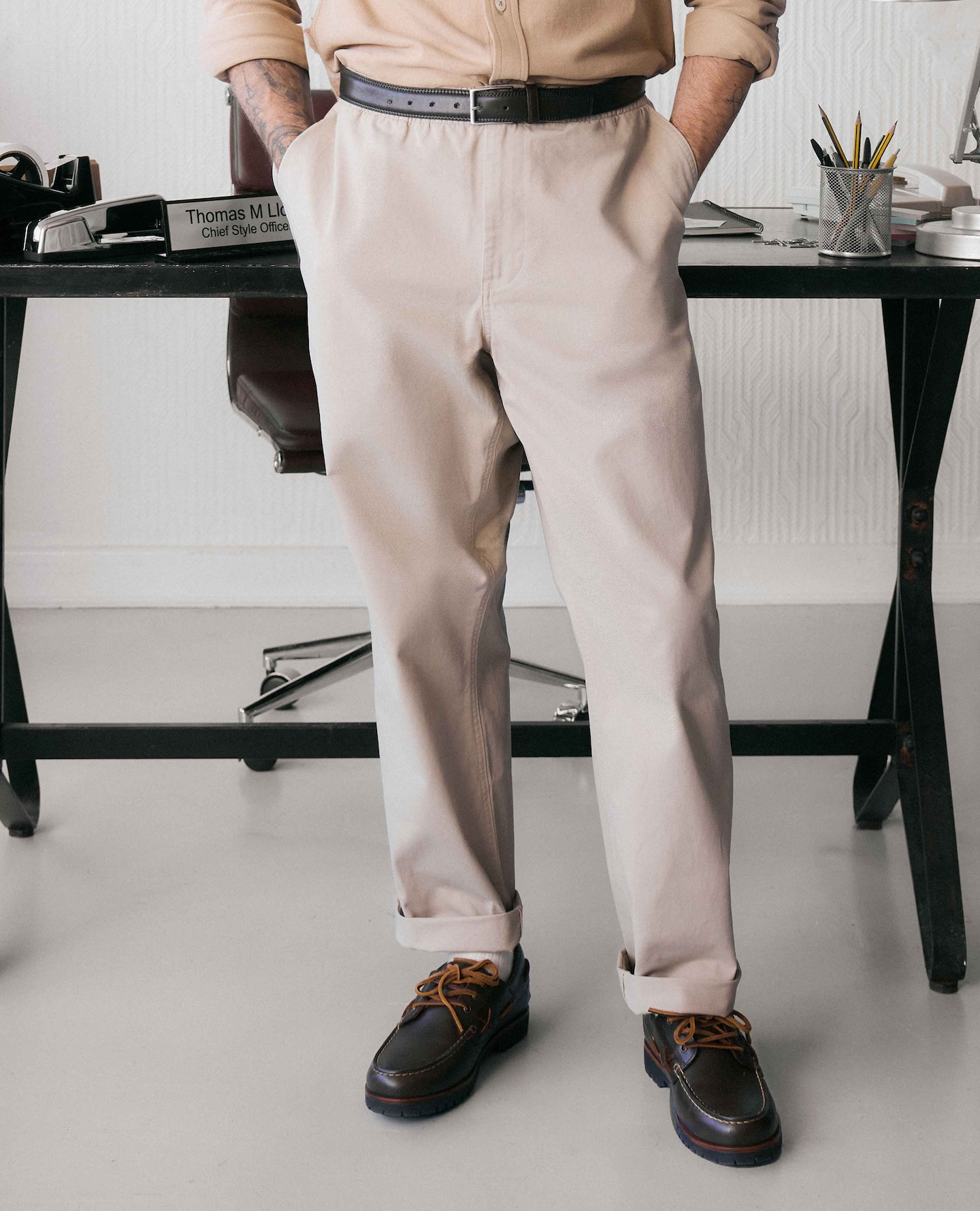 Model wears Beige Chinos