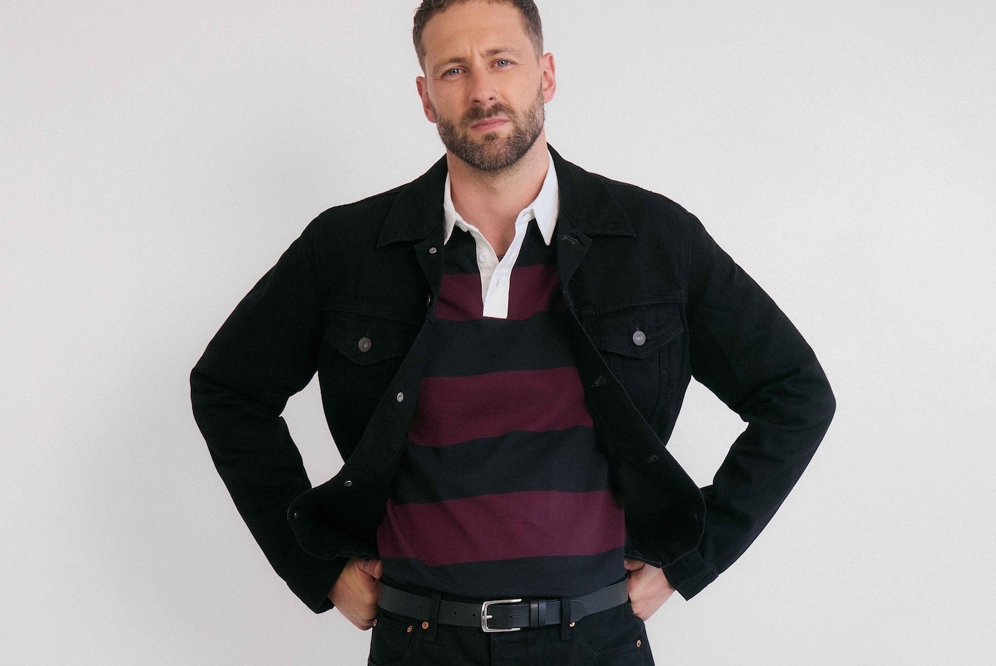 Model wears Levi's Classic Trucker Jacket - Black with Long Sleeve Rugby Polo-Long Length