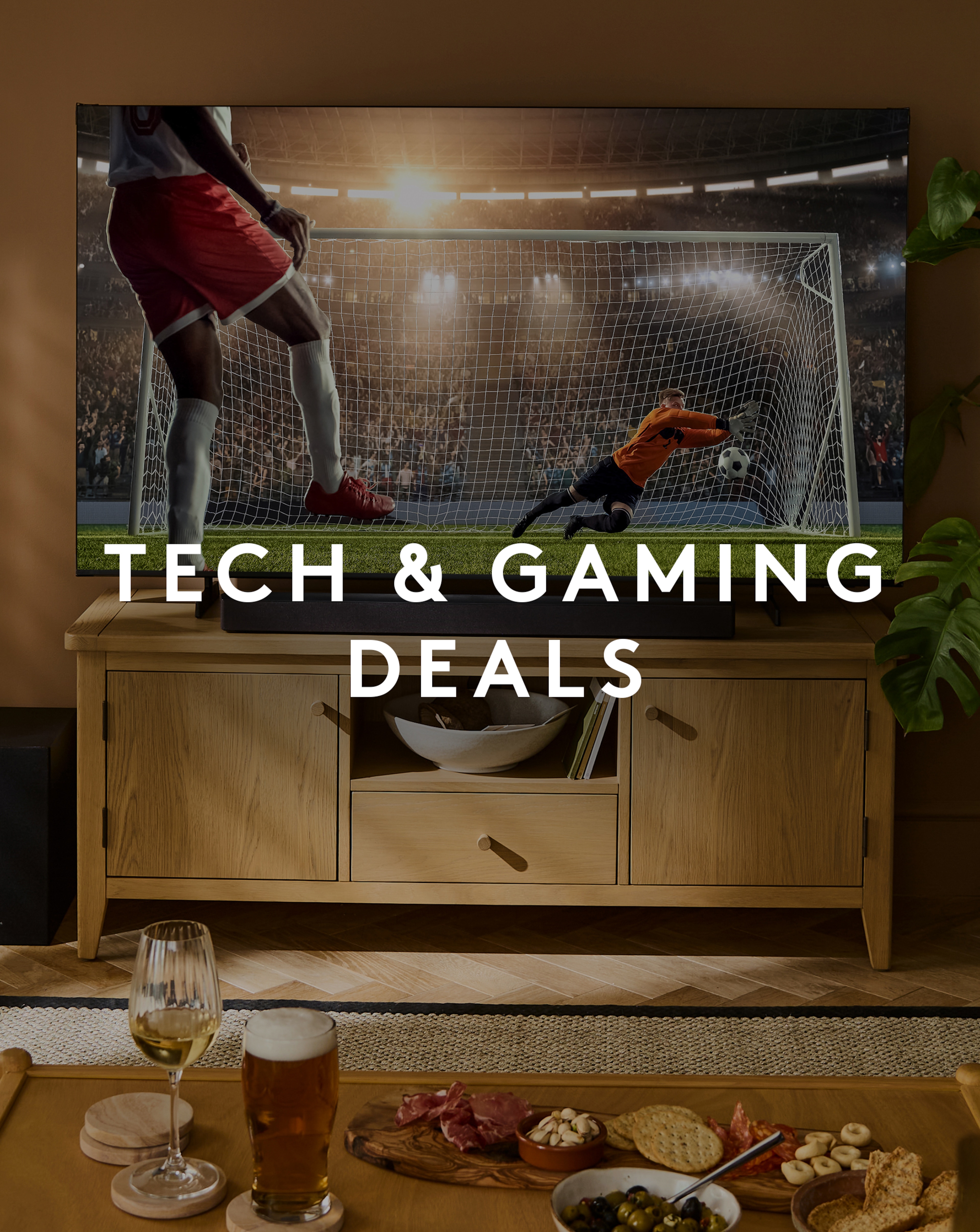Tech & Gaming Deals. Caitlin Ready Assembled Wooden TV Unit with Hisense TV showing football is pictured.