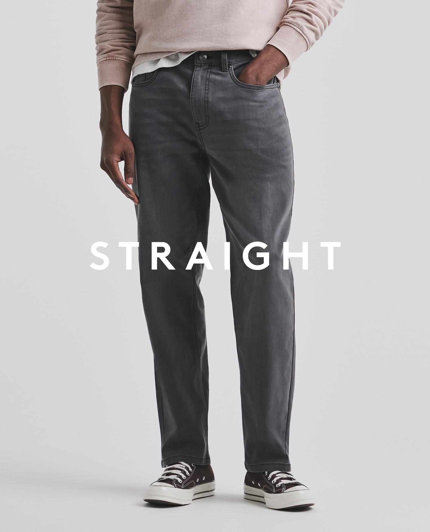 Model wearing straight black jeans