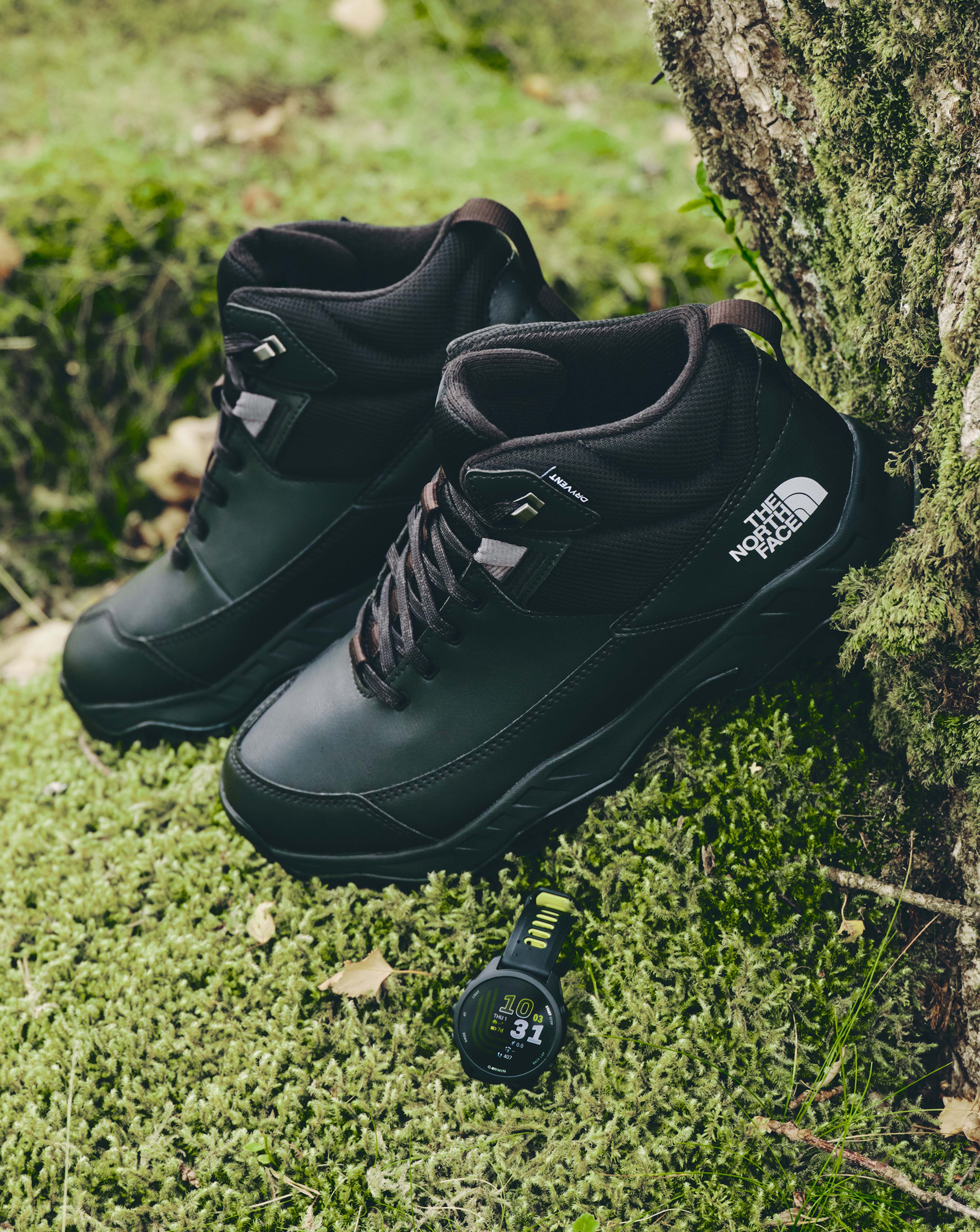 The North Face Storm Strike III Waterproof Boots are pictured with Garmin watch