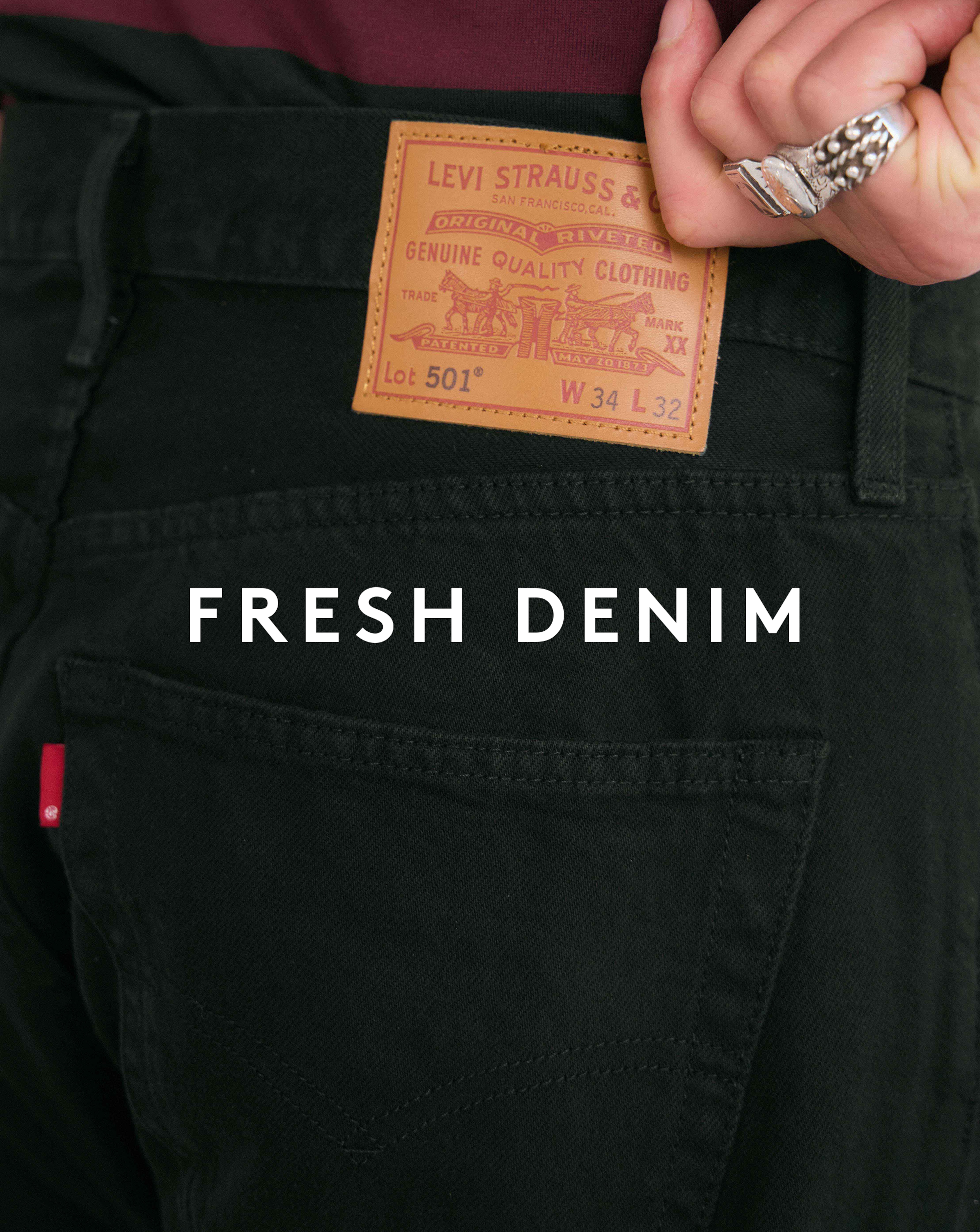 Fresh Denim. Model wears Levi's 501 Original Straight Fit Jean - Worn Black
