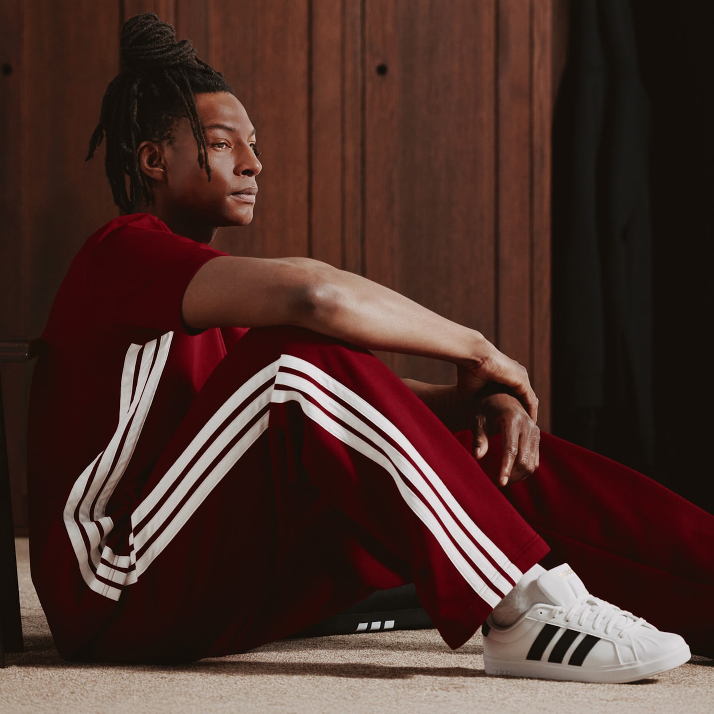 Model wears adidas 3 Stripes T-Shirt with adidas Wide Leg 3 Stripes Fleece Pants and adidas Streettalk Trainers