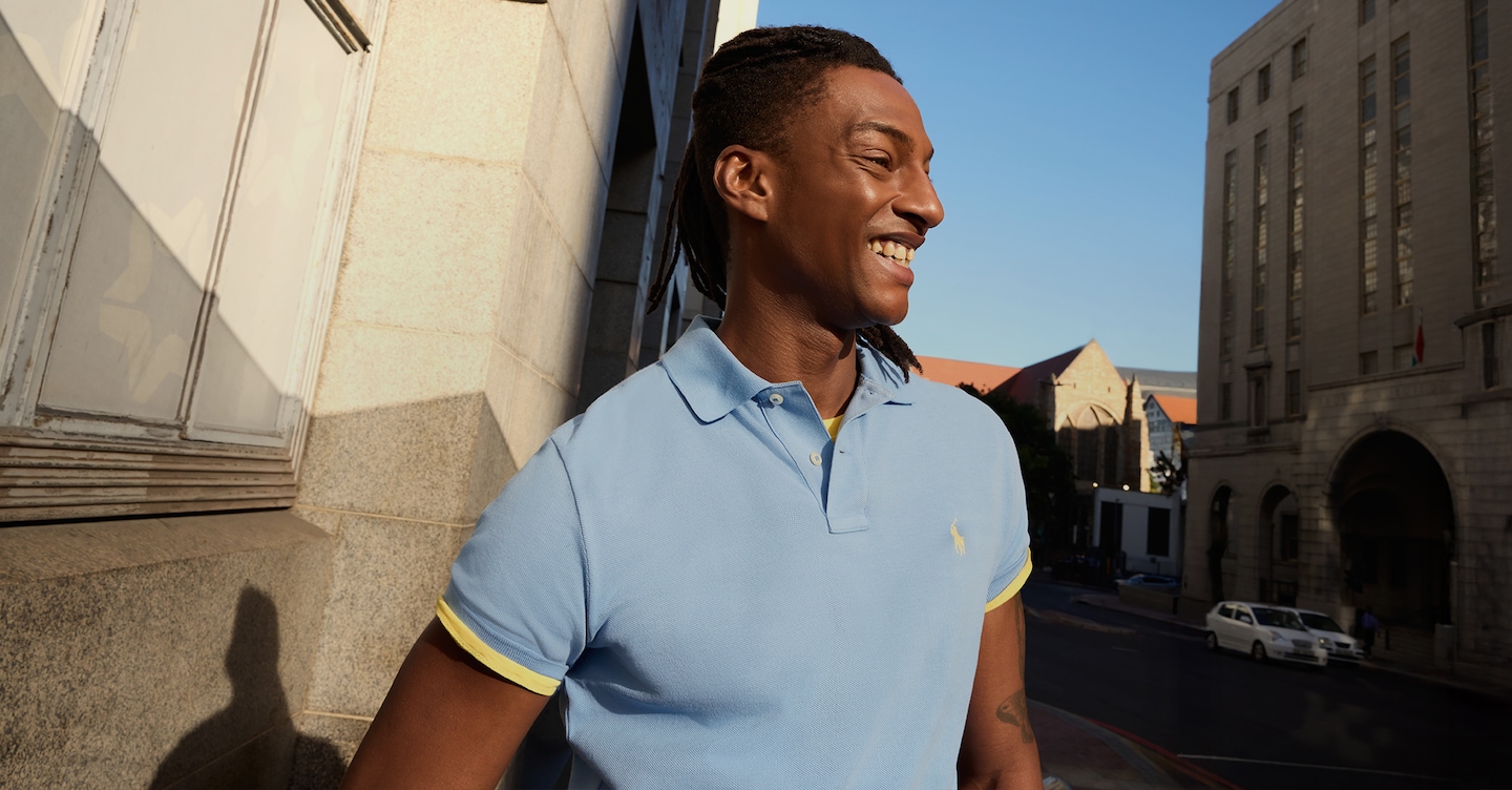 Polo Ralph Lauren Colour Shop. Model wears Polo Ralph Lauren Classic Short Sleeve Polo in Light Blue/Yellow