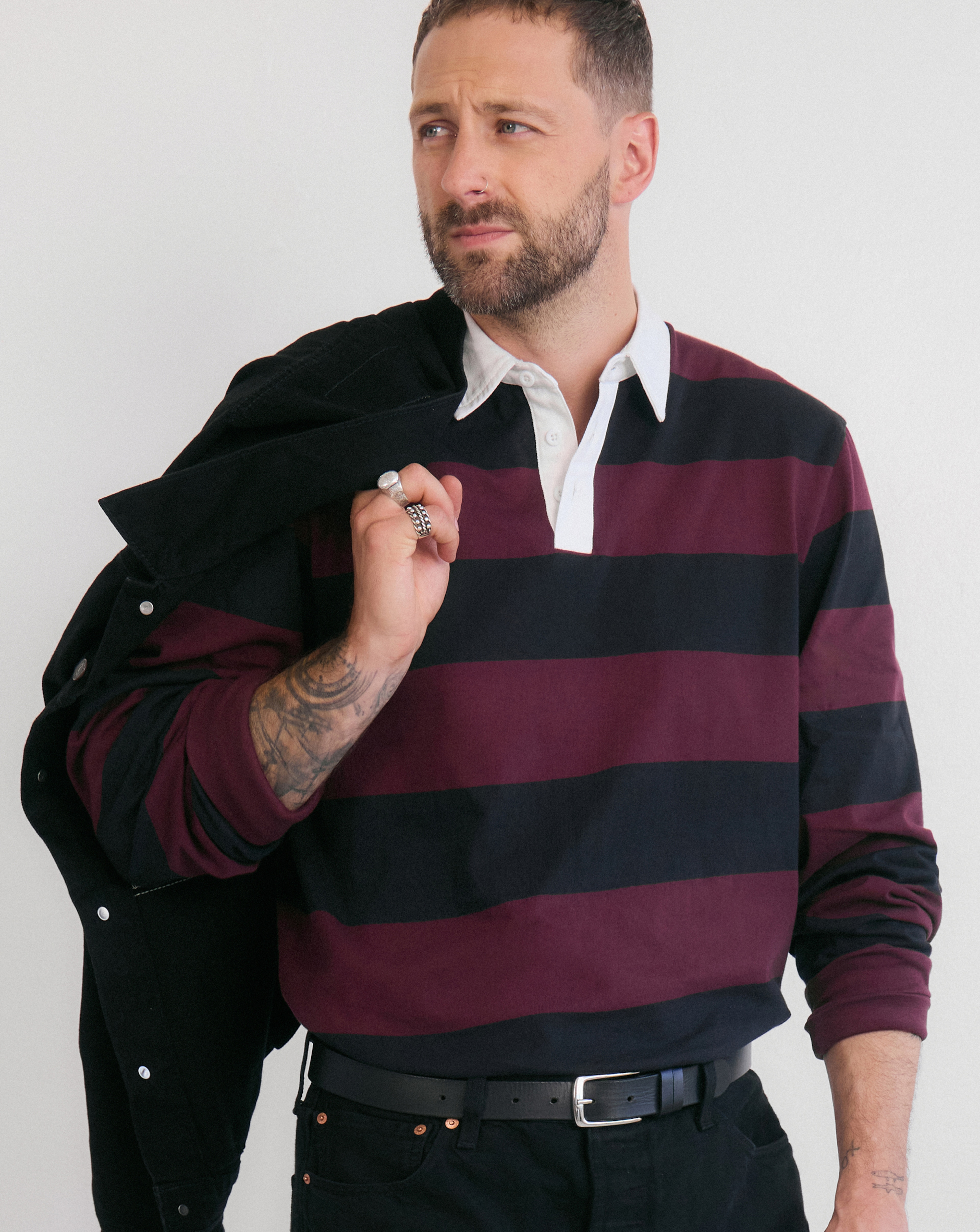 Thomas M Lloyd wears stripe polo rugby shirt