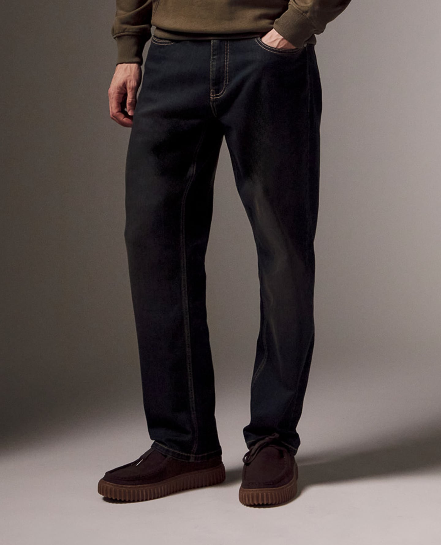 Model wears Slim Fit Stretch Jean Dark Wash Jeans with Brown Suede Loafers
