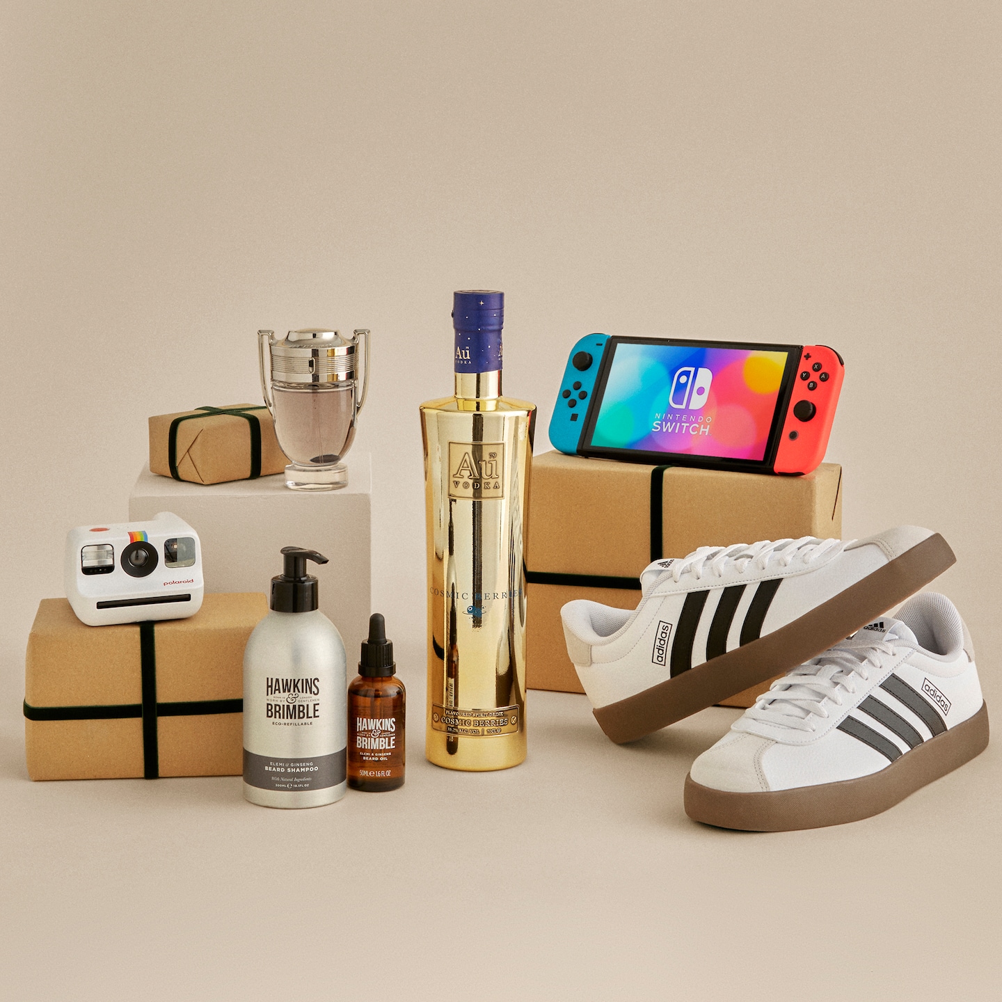 Multiple products including adidas trainers, Nintendo Switch and AU vodka laid out next to each other