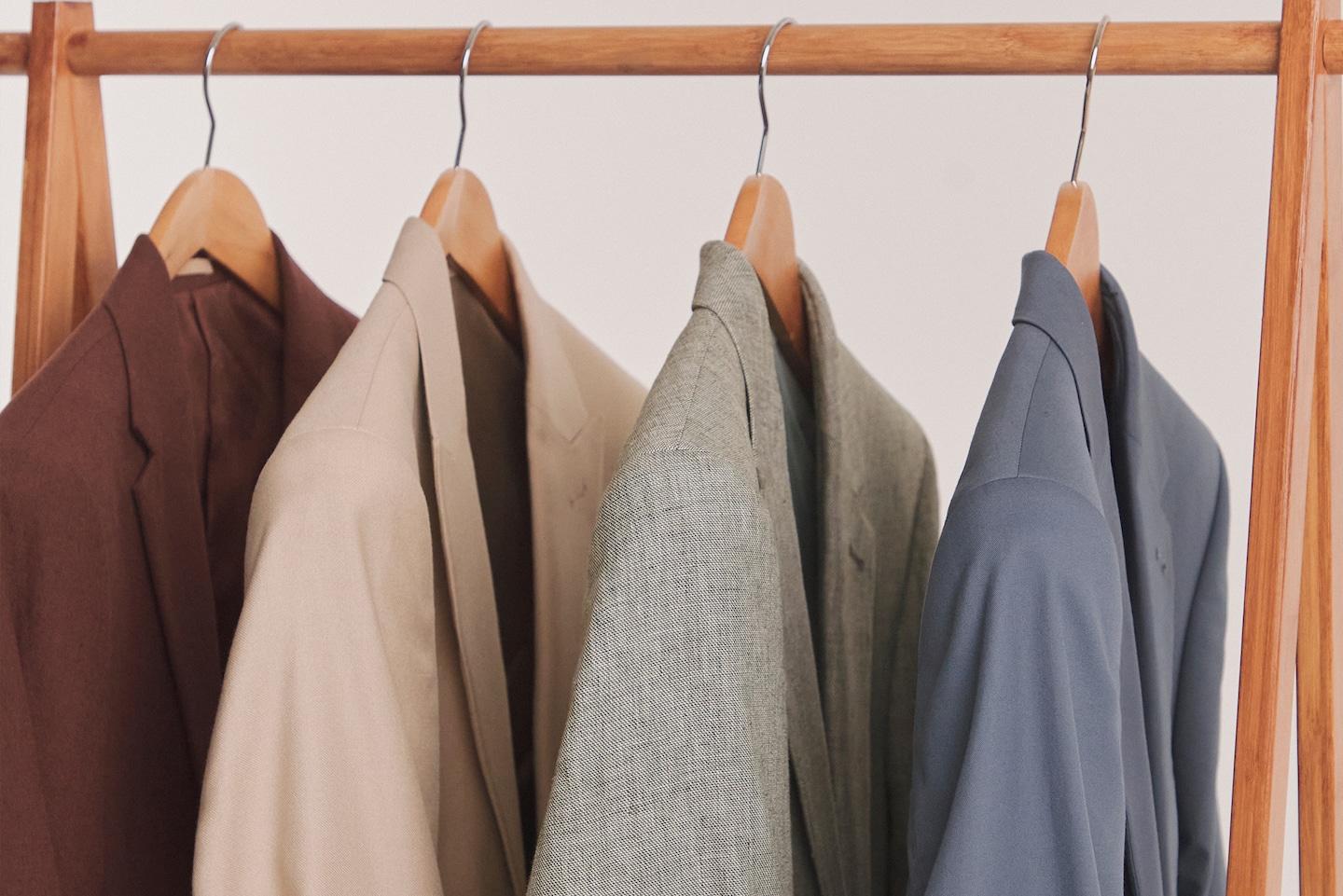 Image shows suit Blazers hung on a rail including Linen Blend Suit Jacket in Light Green