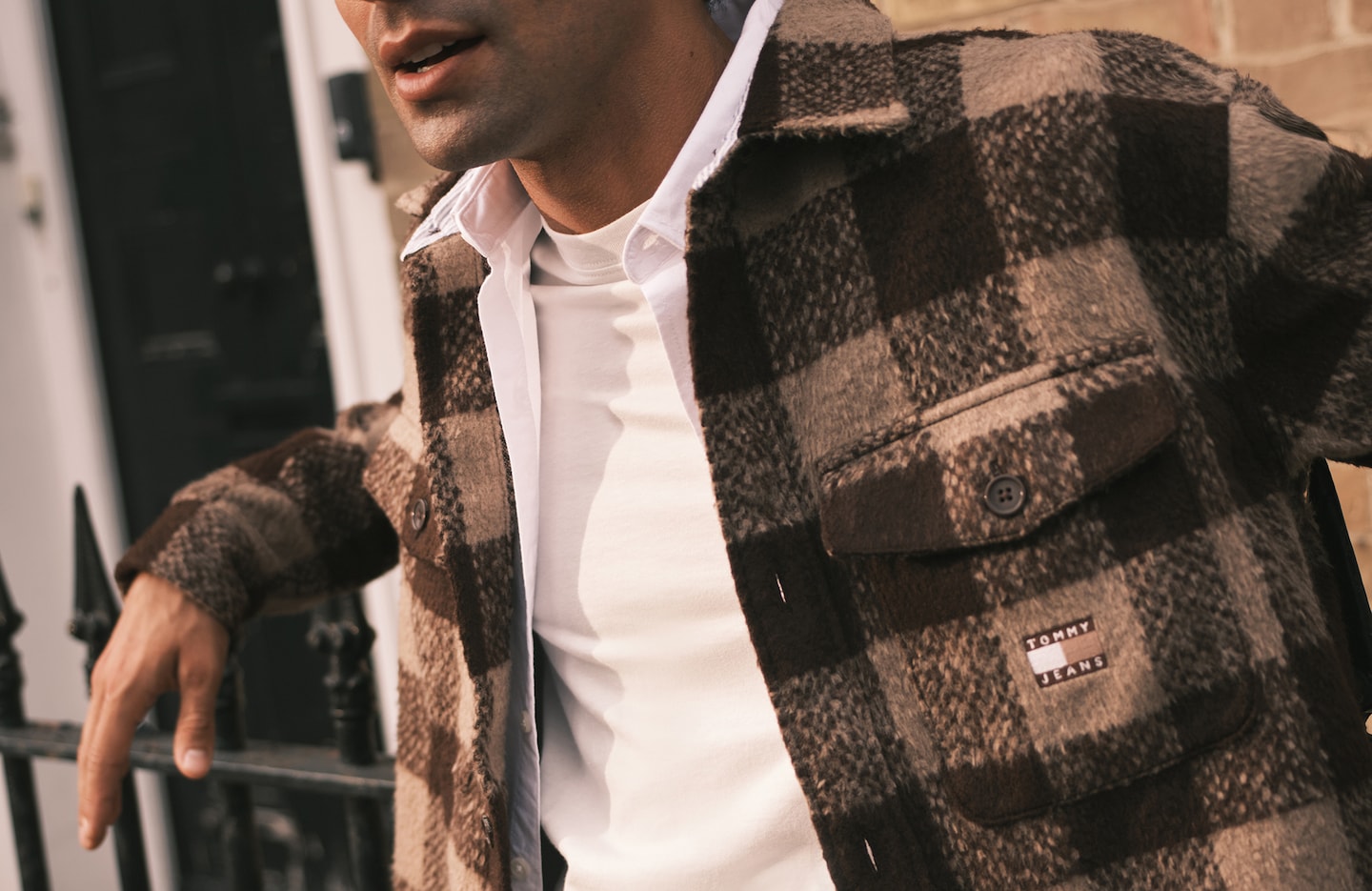 Model wears check shirt jacket from Tommy Hilfiger