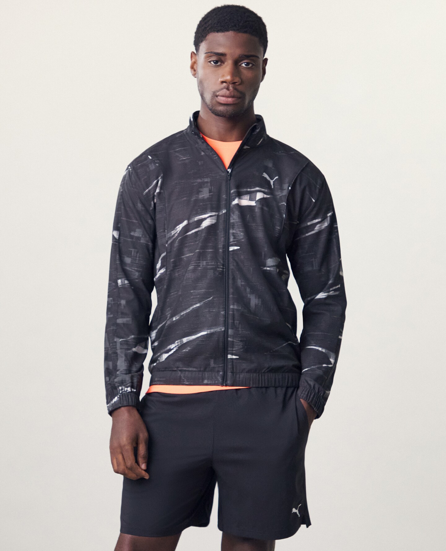 Model wears PUMA Run Velocity Printed Jacket