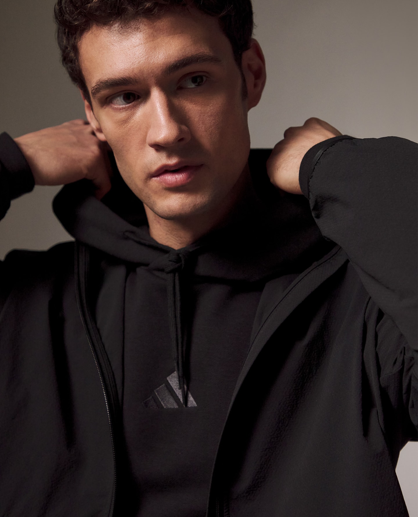 Model wears adidas 3 Stripes Fleece Hoodie in Black