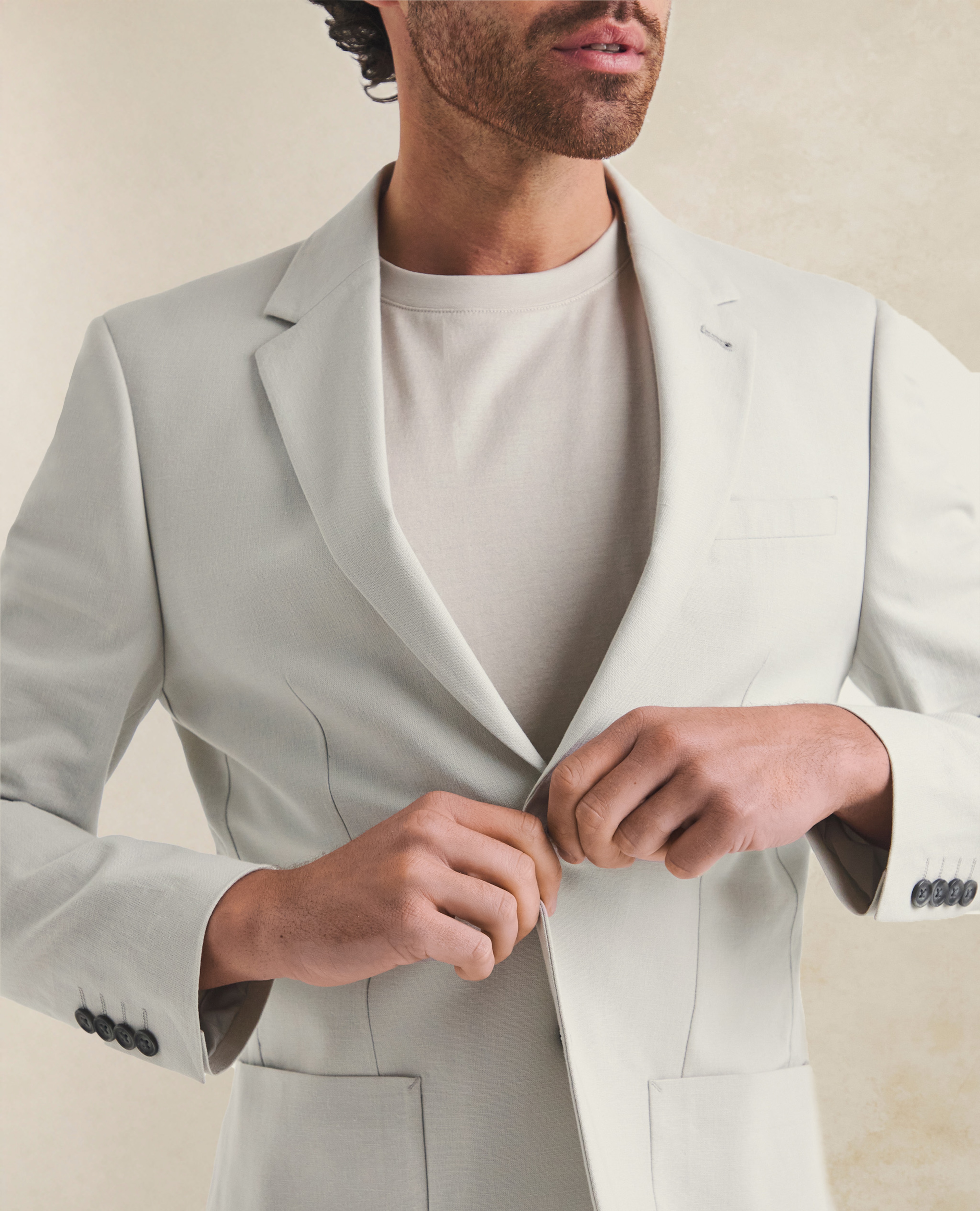 Model wearing a Folio white blazer