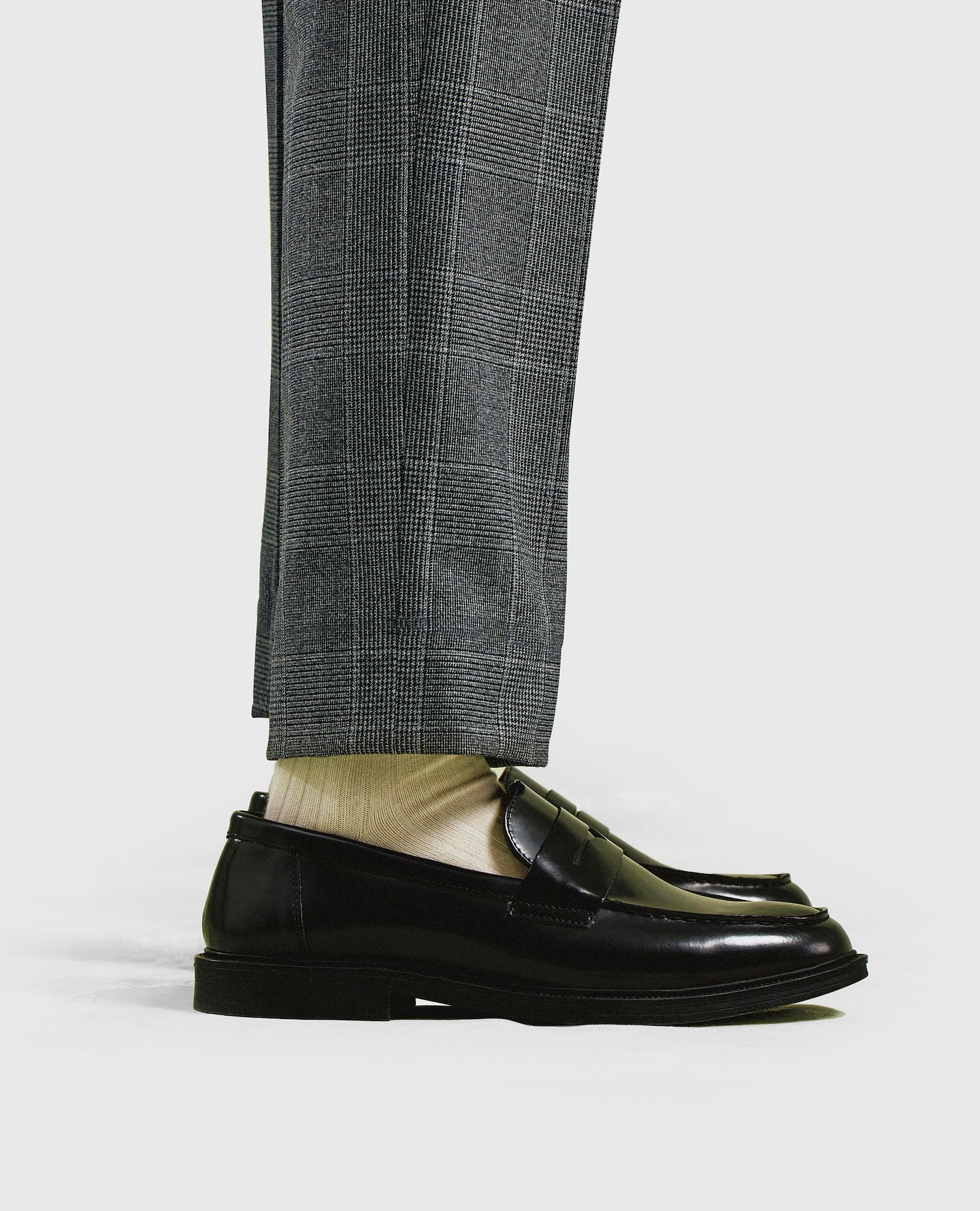 Model wears smart black shoes