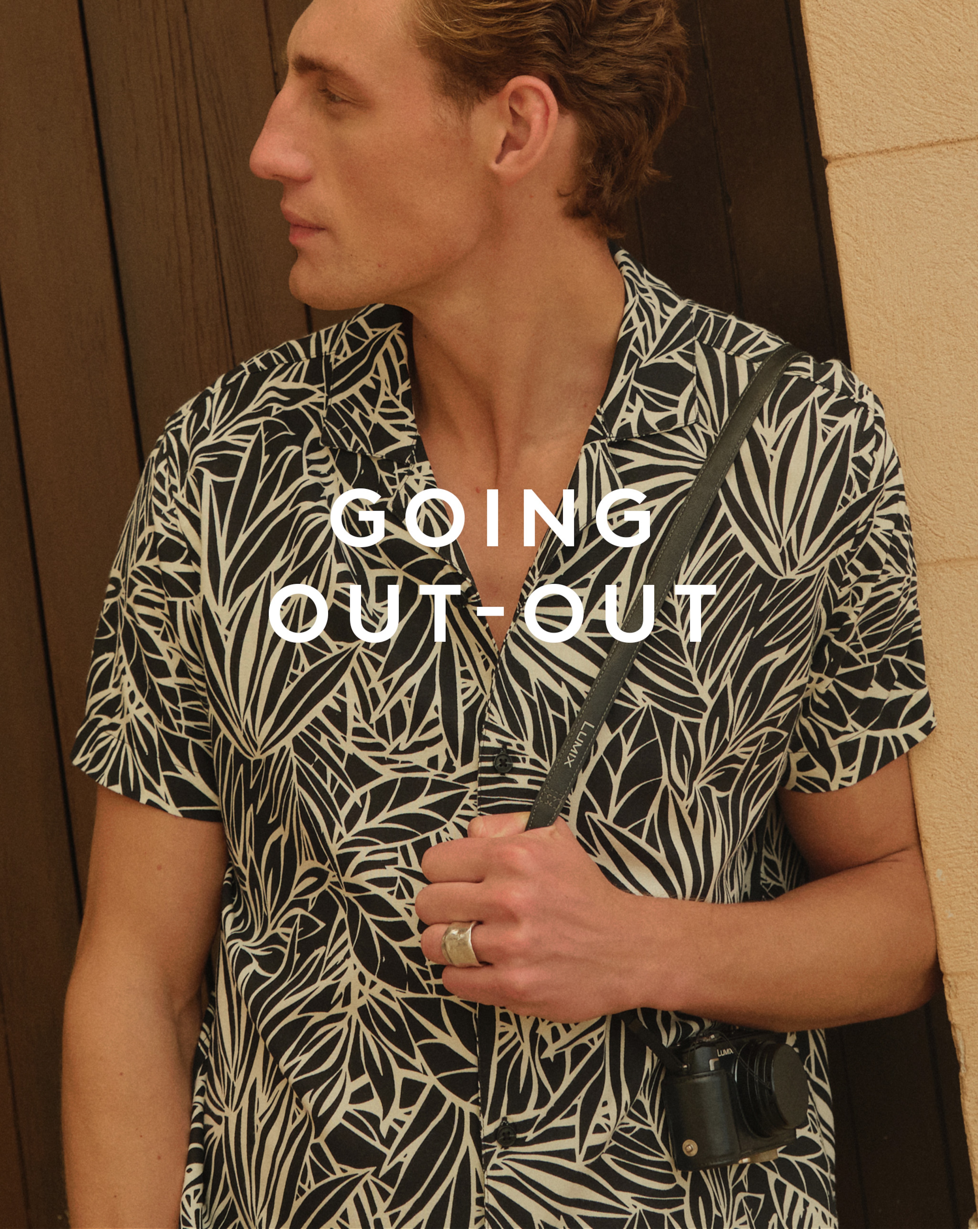 Model wearing patterned, black and white, shirt