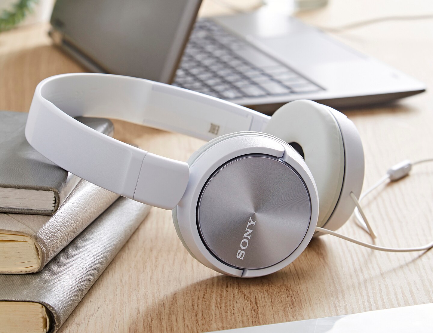 A pair of white Sony headphones