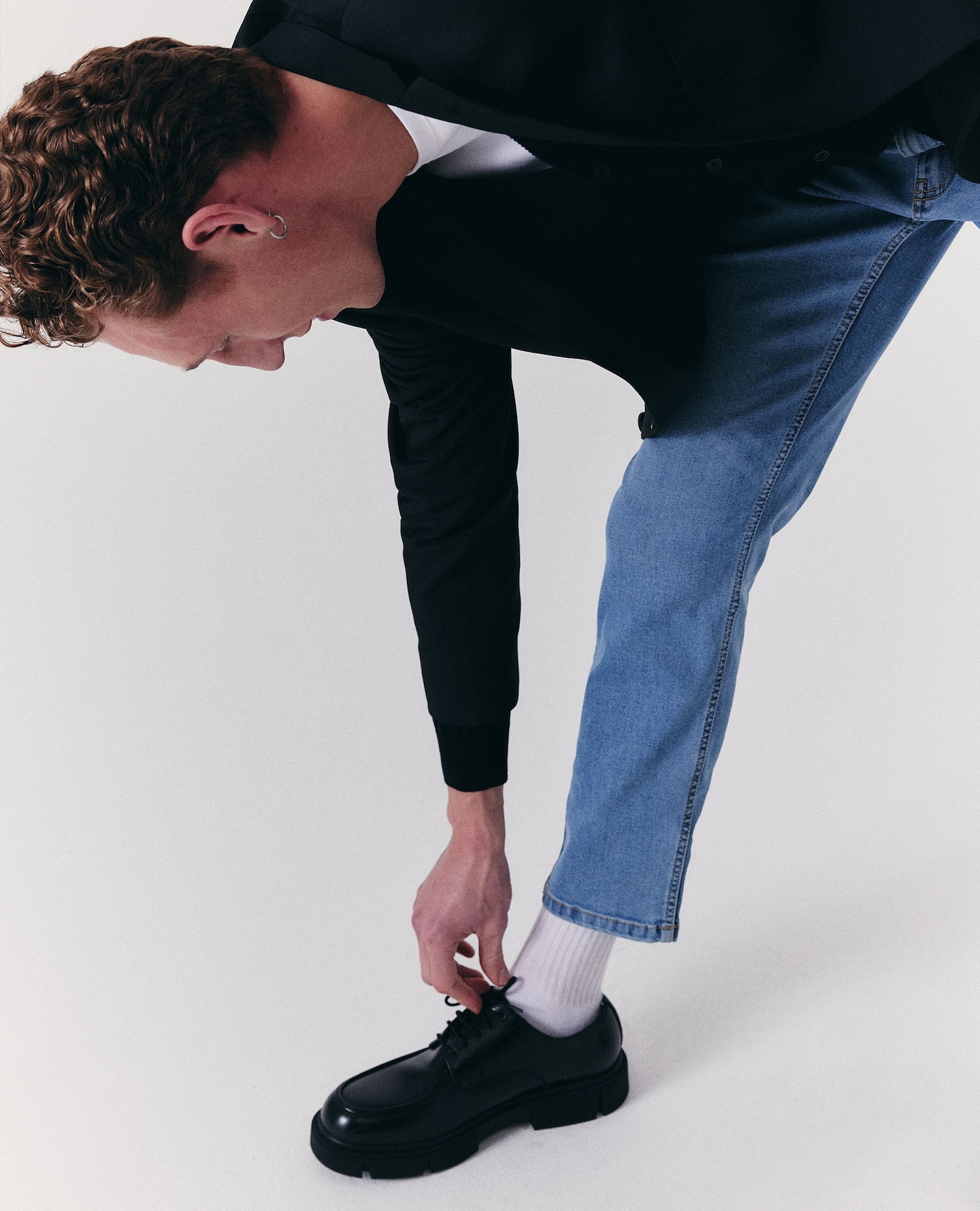 Model wears tapered fit jean