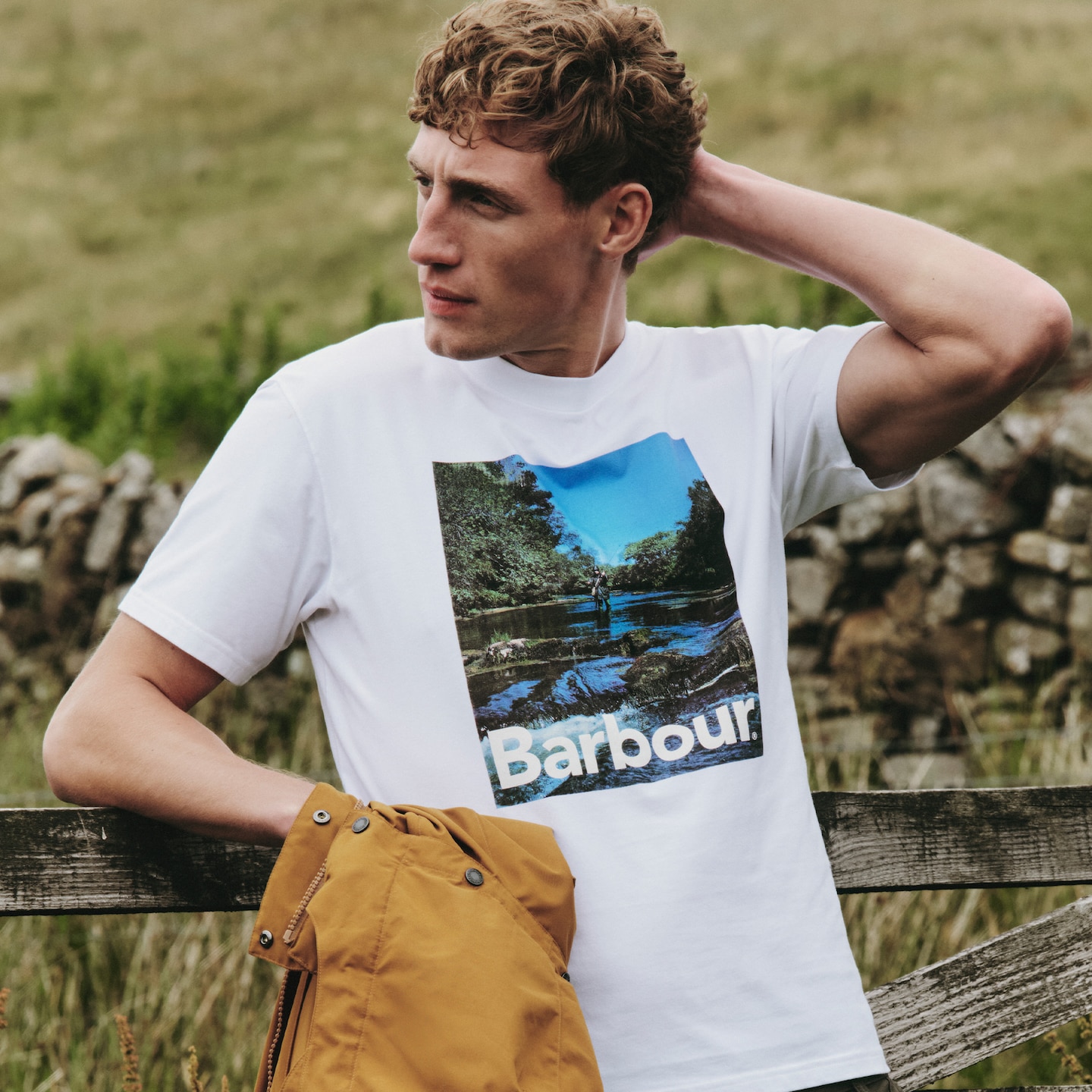 Model wearing a white Barbour graphic t-shirt