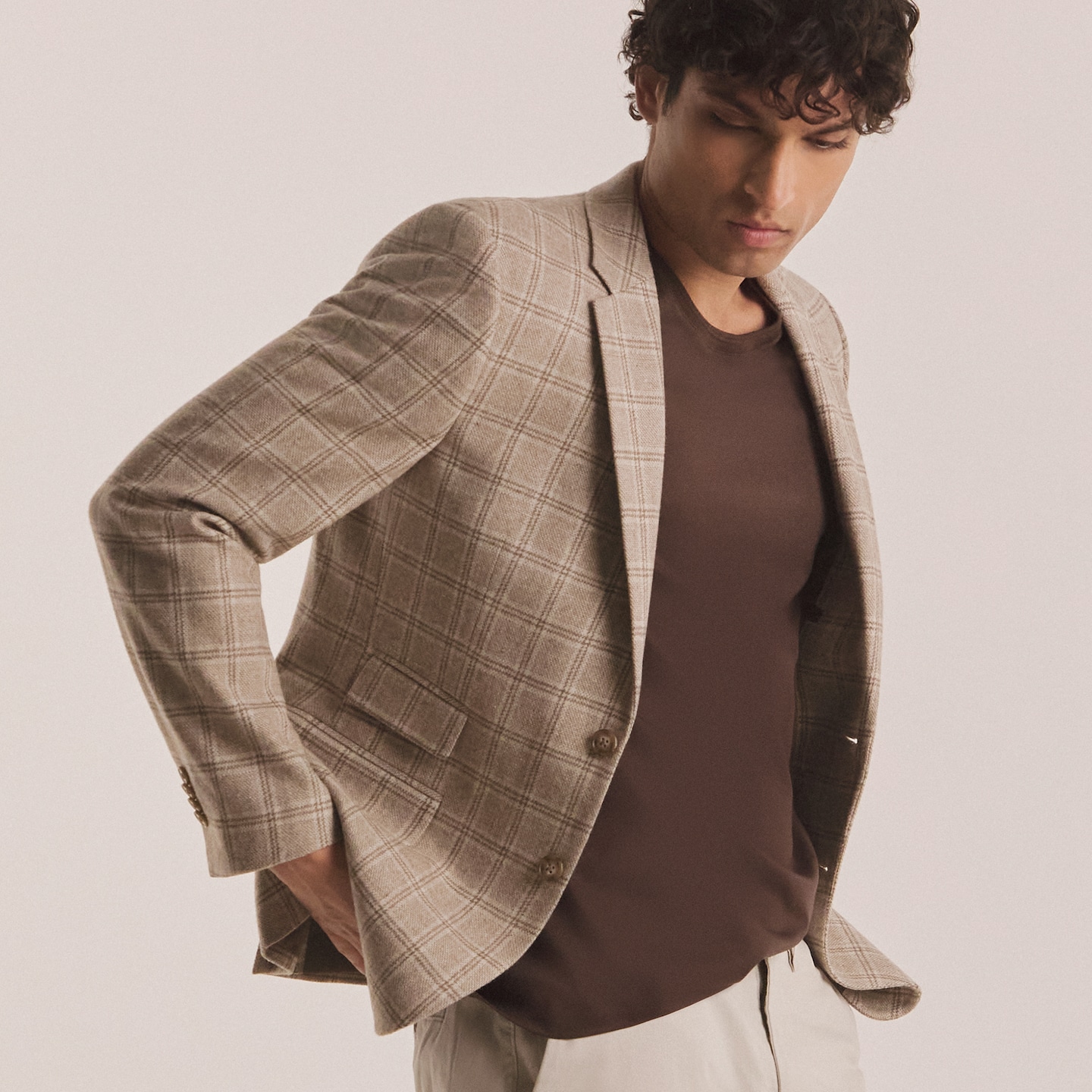 Model wears Tailored Heritage Patch Check Blazer with brown tshirt