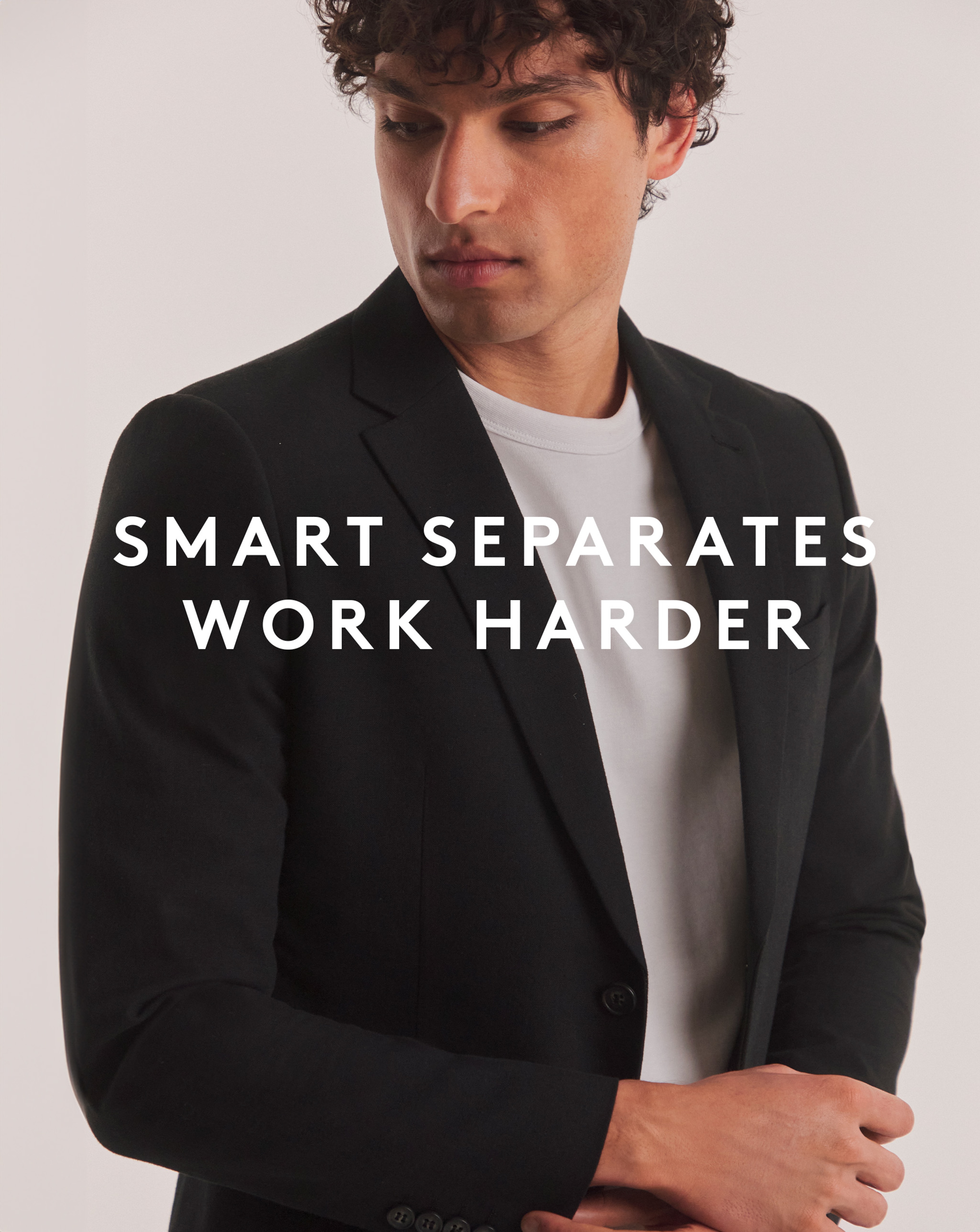 Model wearing black blazer and white t-shirt