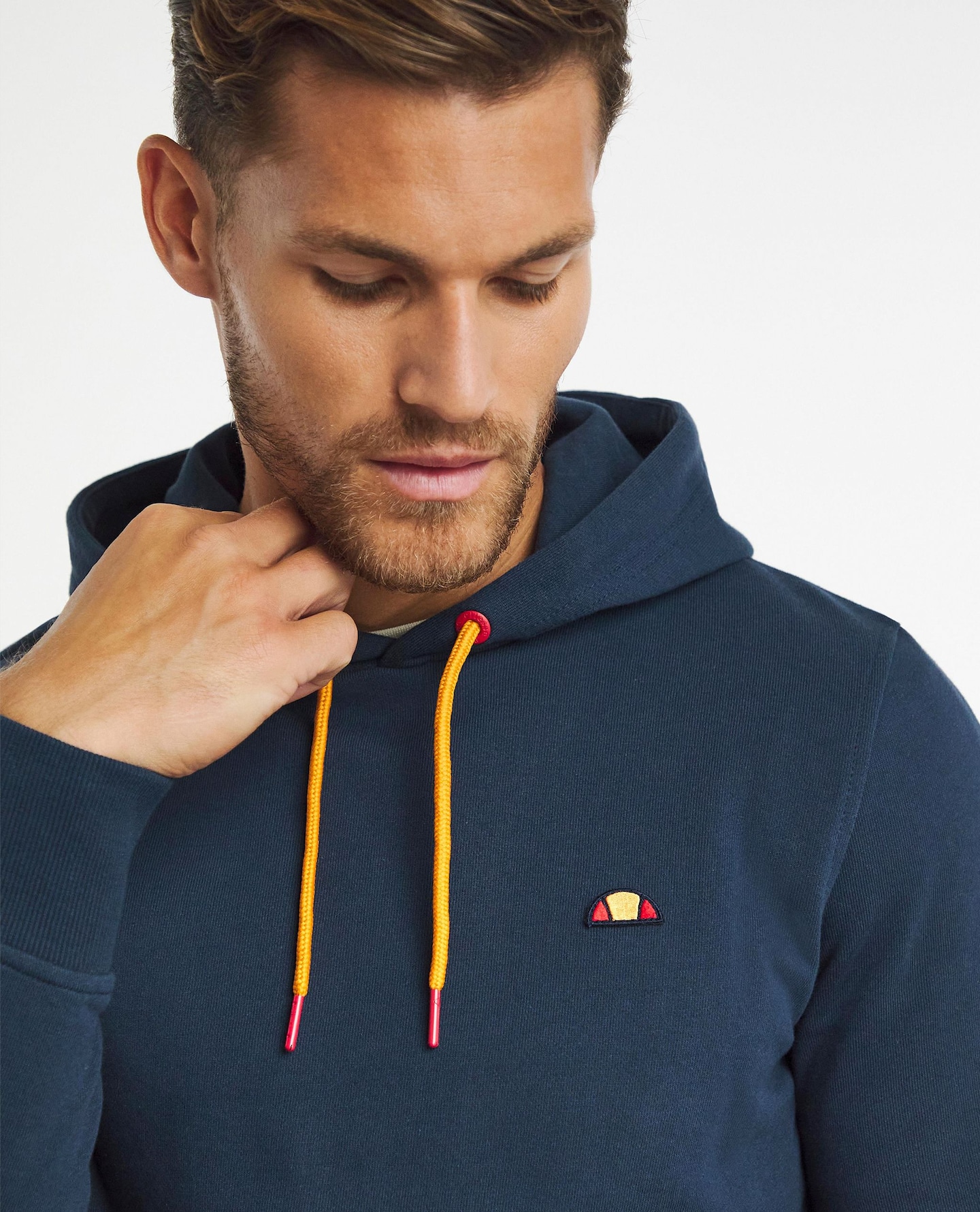 Model wearing navy Ellesse sports hoodie